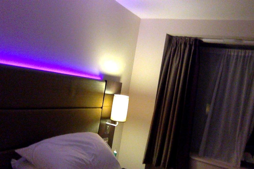 This hotel room has an embedded UV light behind the bed r