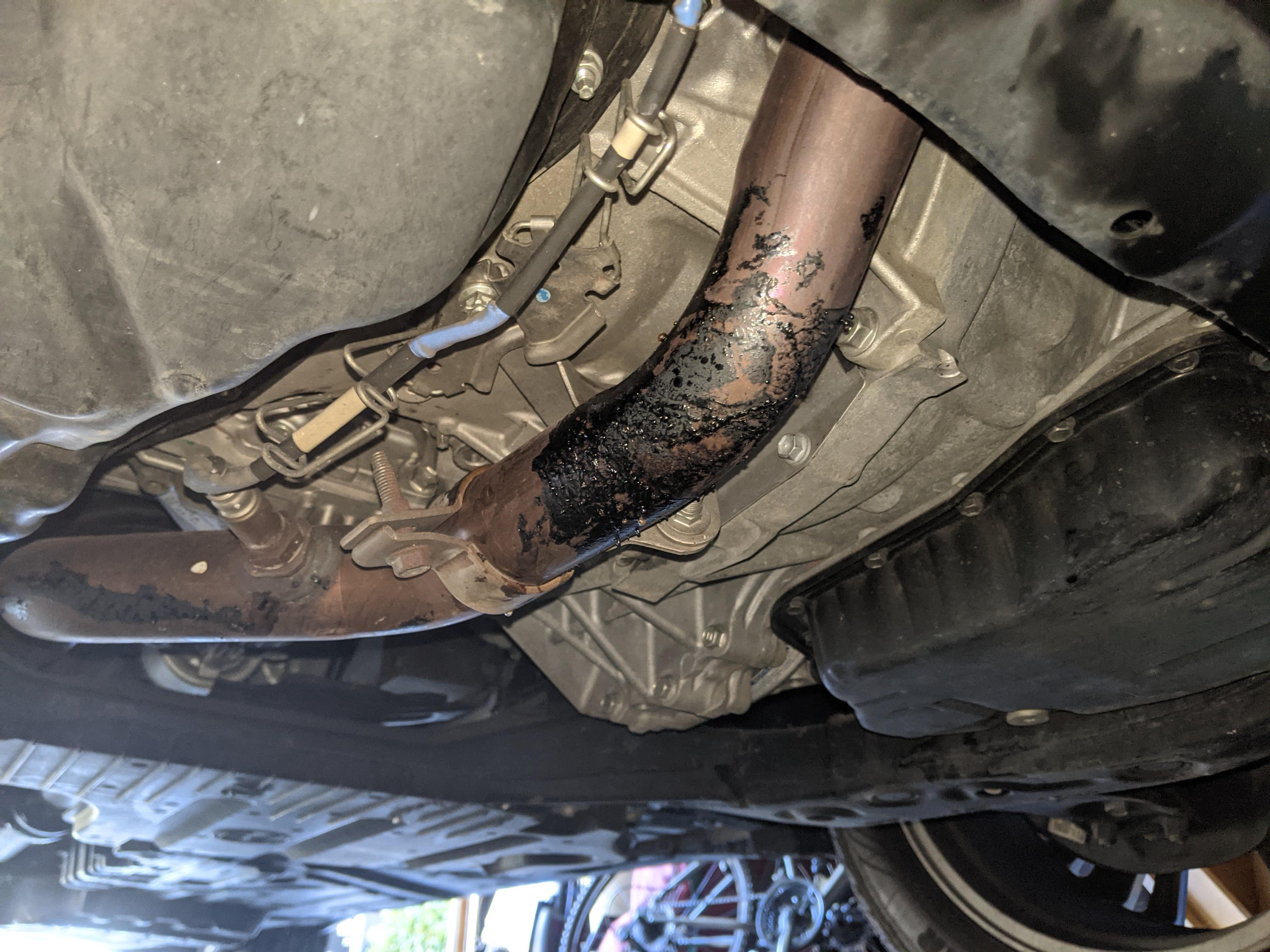 My mom ran over a black trash bag, and smells burning plastic when she