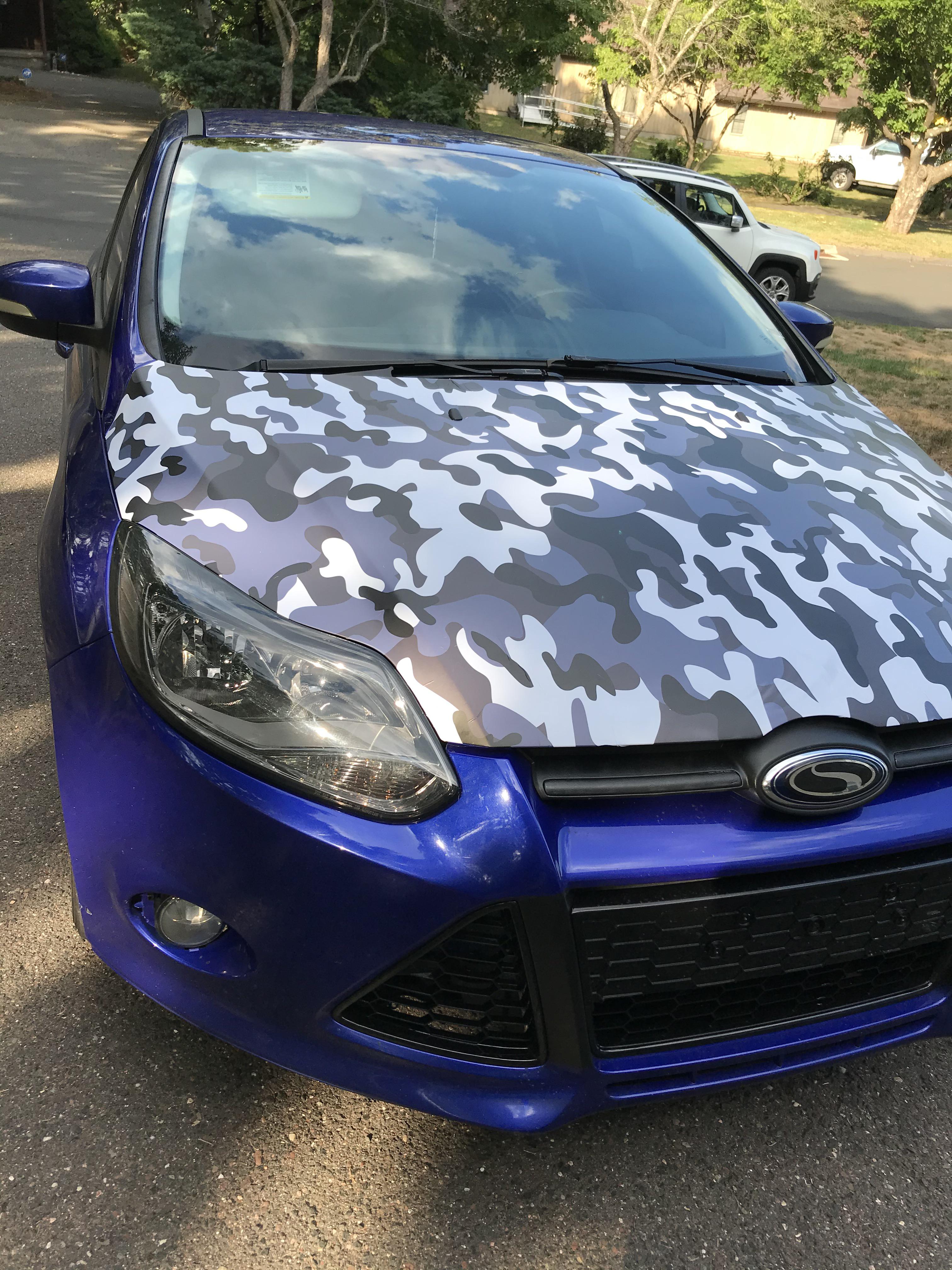 Just said f*** it and tried to wrap my hood myself. GF helped. Fun