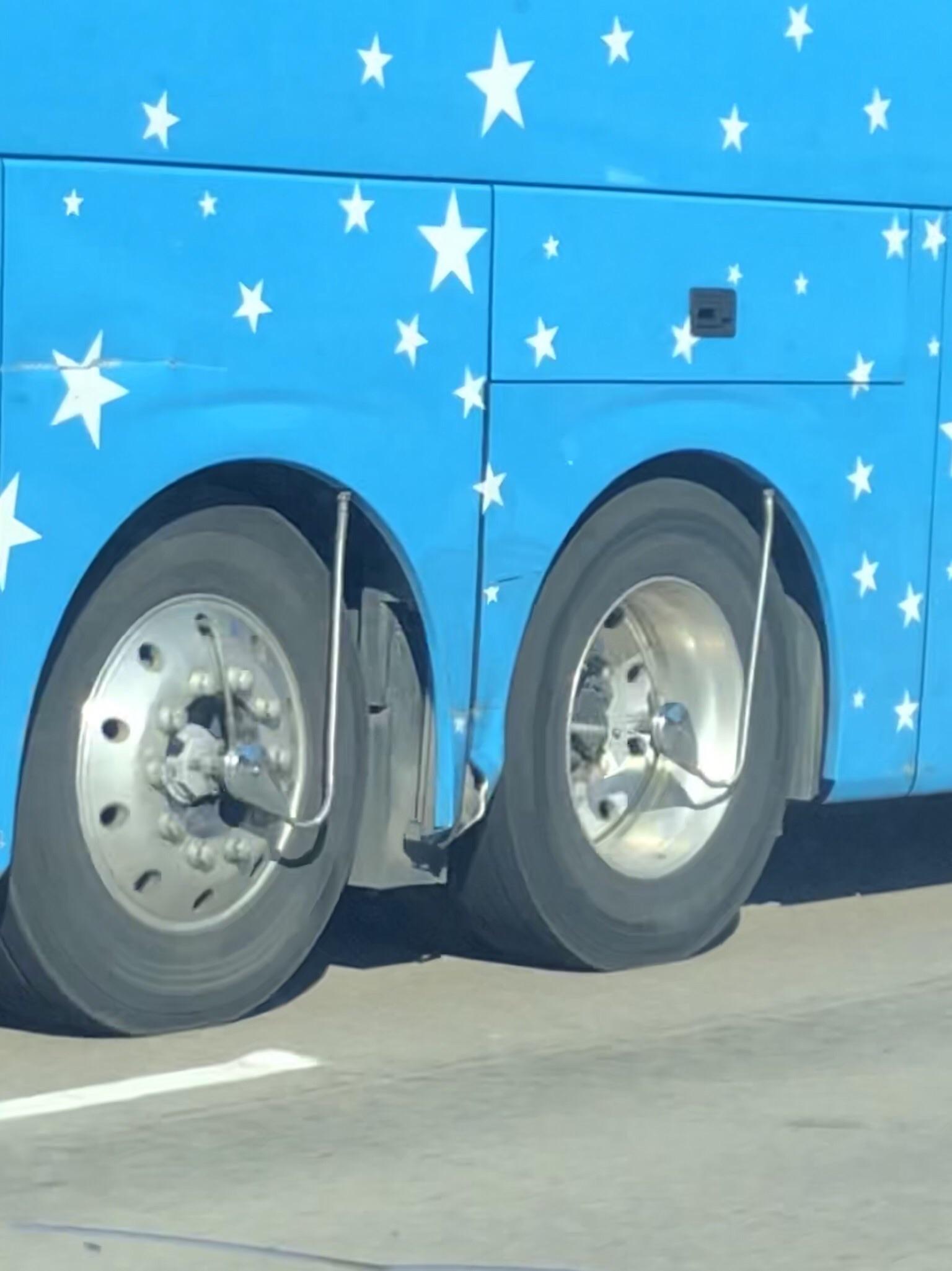 What are these rods connected to the center of these bus wheels? r