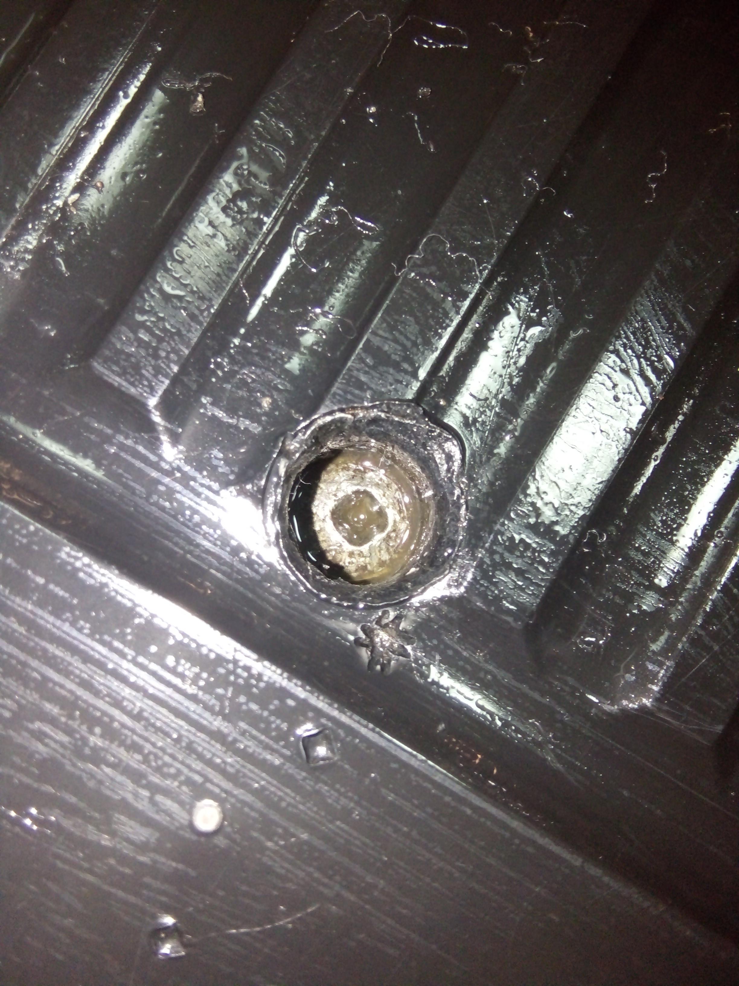 How to remove a rusted screw with an loosen head in a place like that