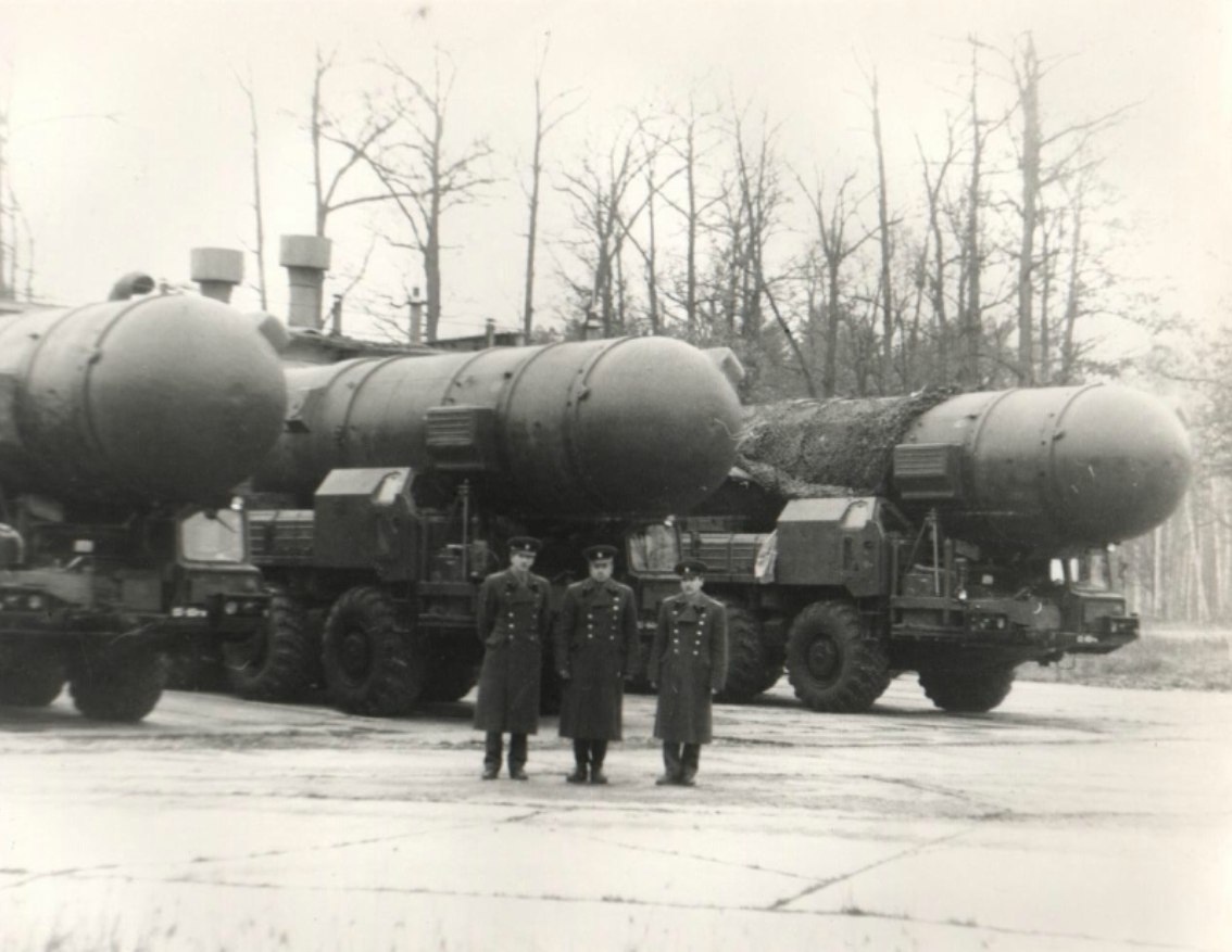 Soviet officers standing next to three SS20 missile TELs. r/MissilePorn