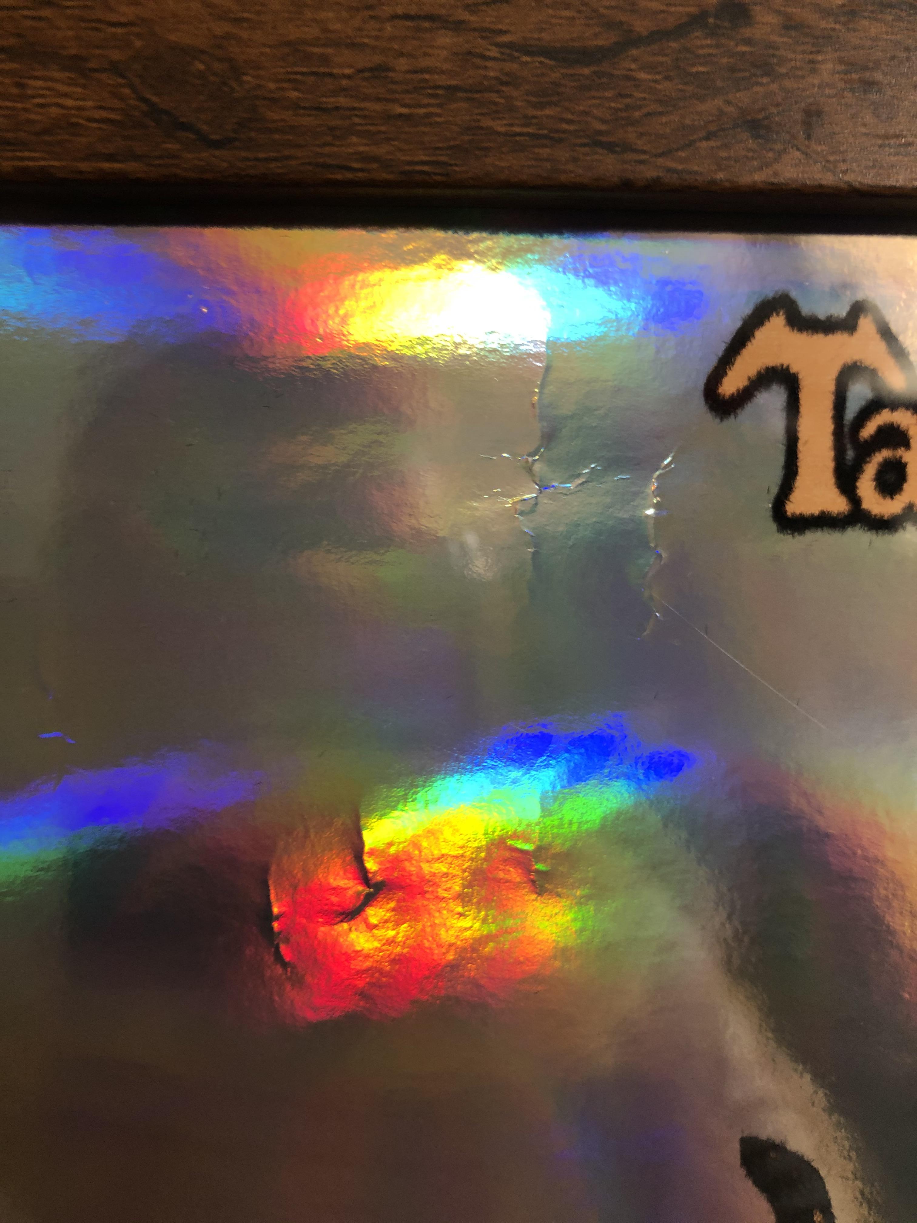 Anyone know how to fix wrinkles on these holographic posters from TT