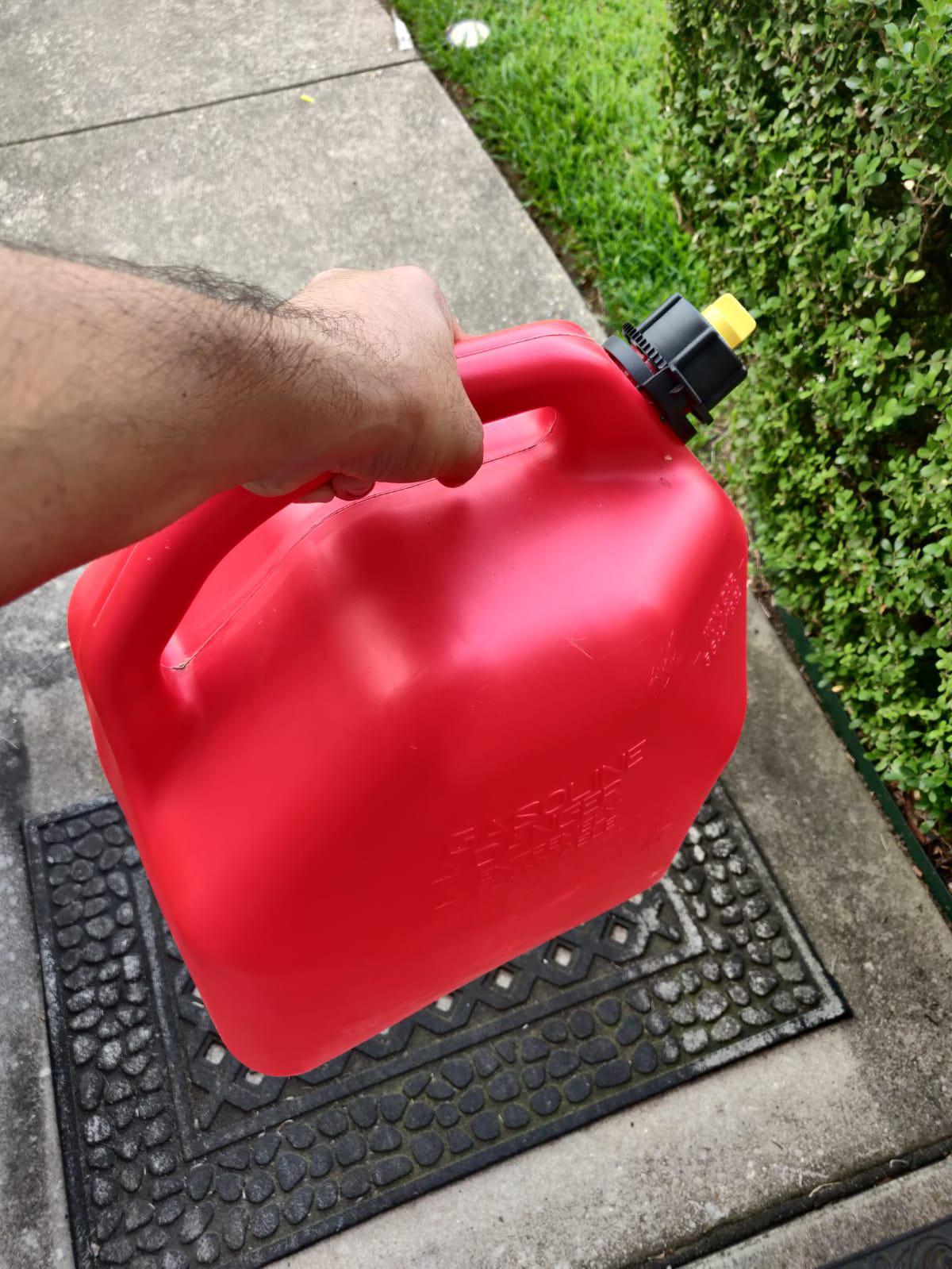 Holding Gasoline Can