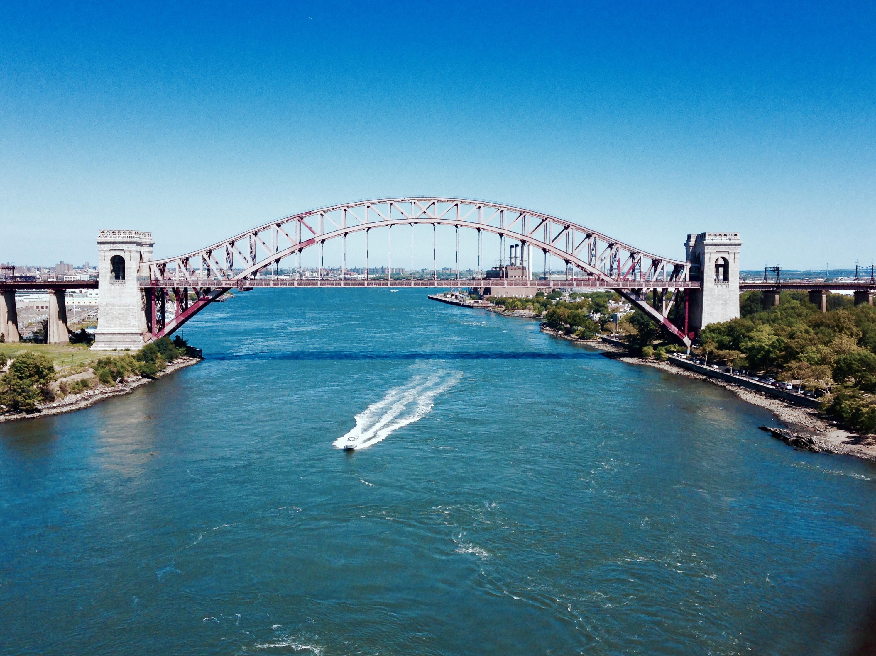 Hell Gate Bridge crosses the Hell Gate strait between Randall’s Island