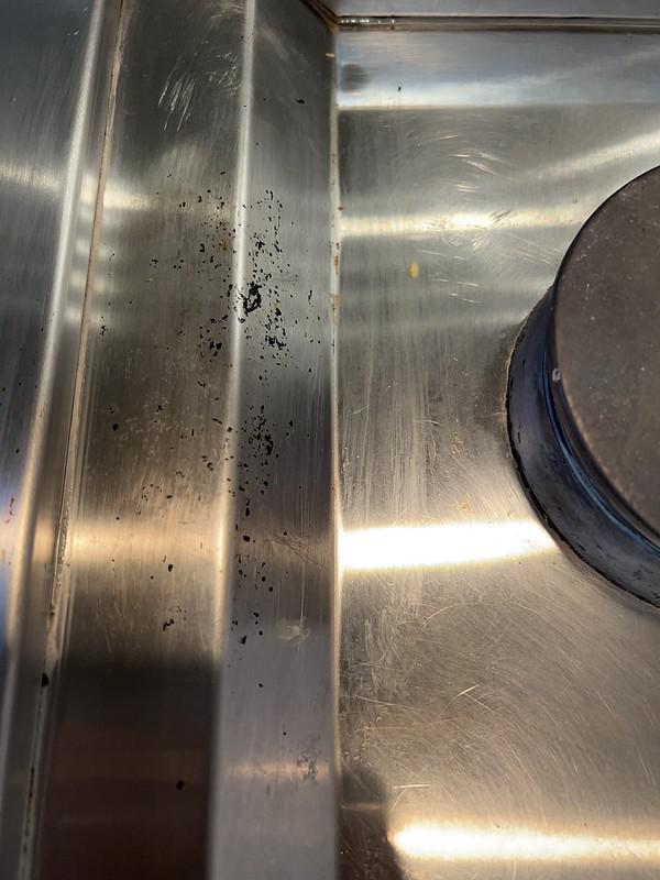 How Do I Remove the Embedded Carbon in My Stainless Steel Stove Top