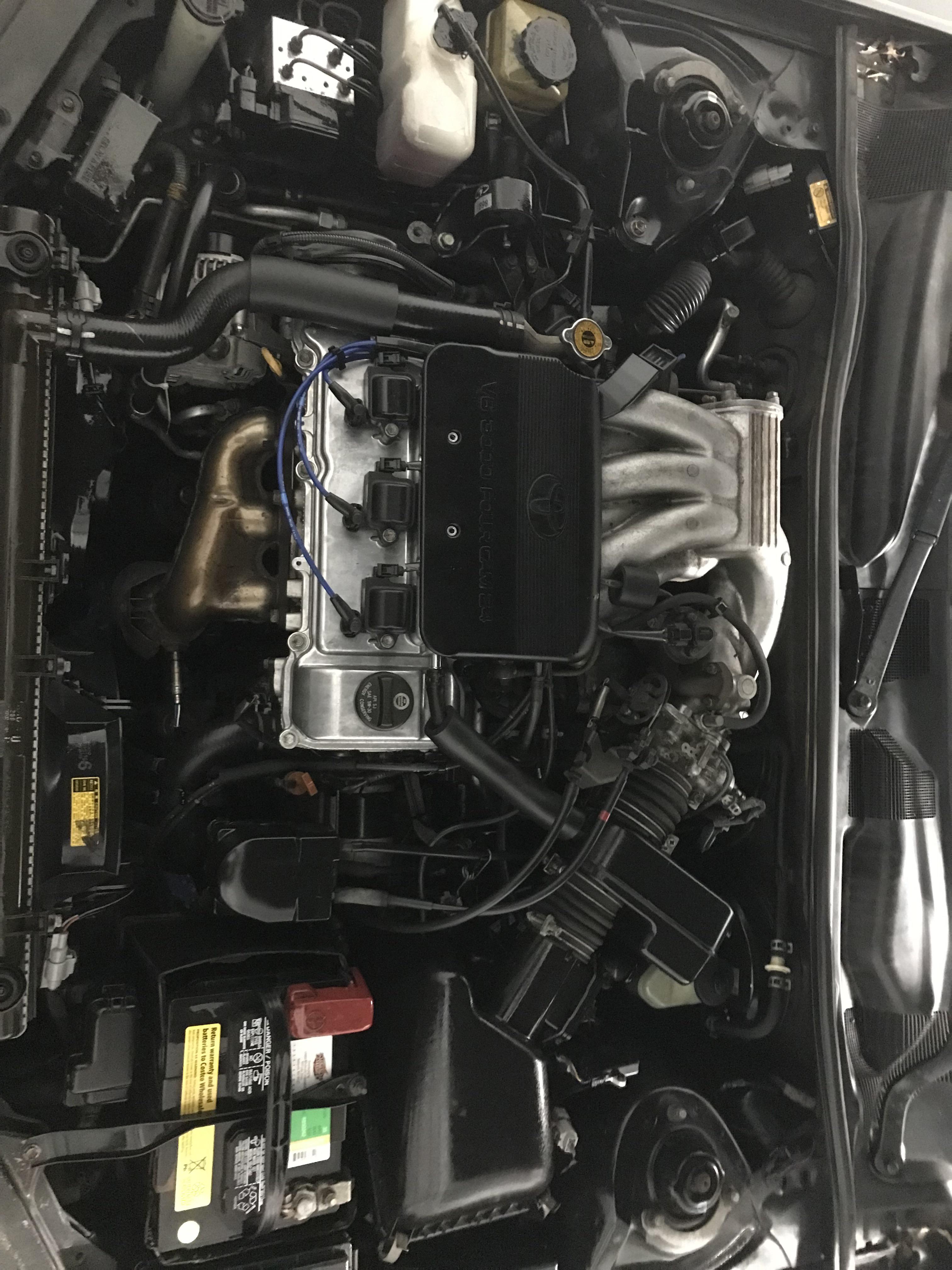 My 1999 Toyota Camry LE engine bay after a cleaning and cylinder head