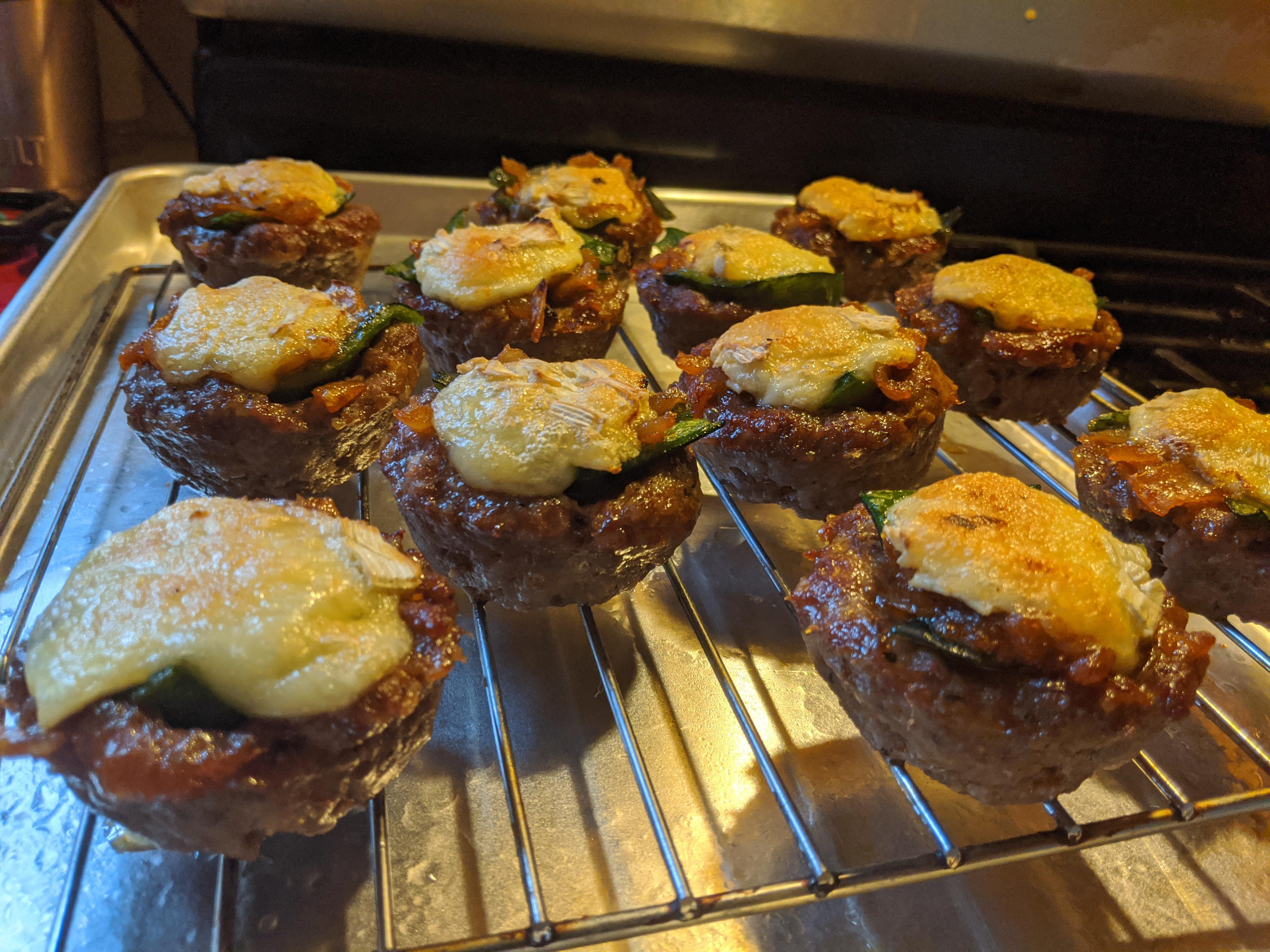[homemade] spicy Italian sausage tarts. Filled with carmalised onion
