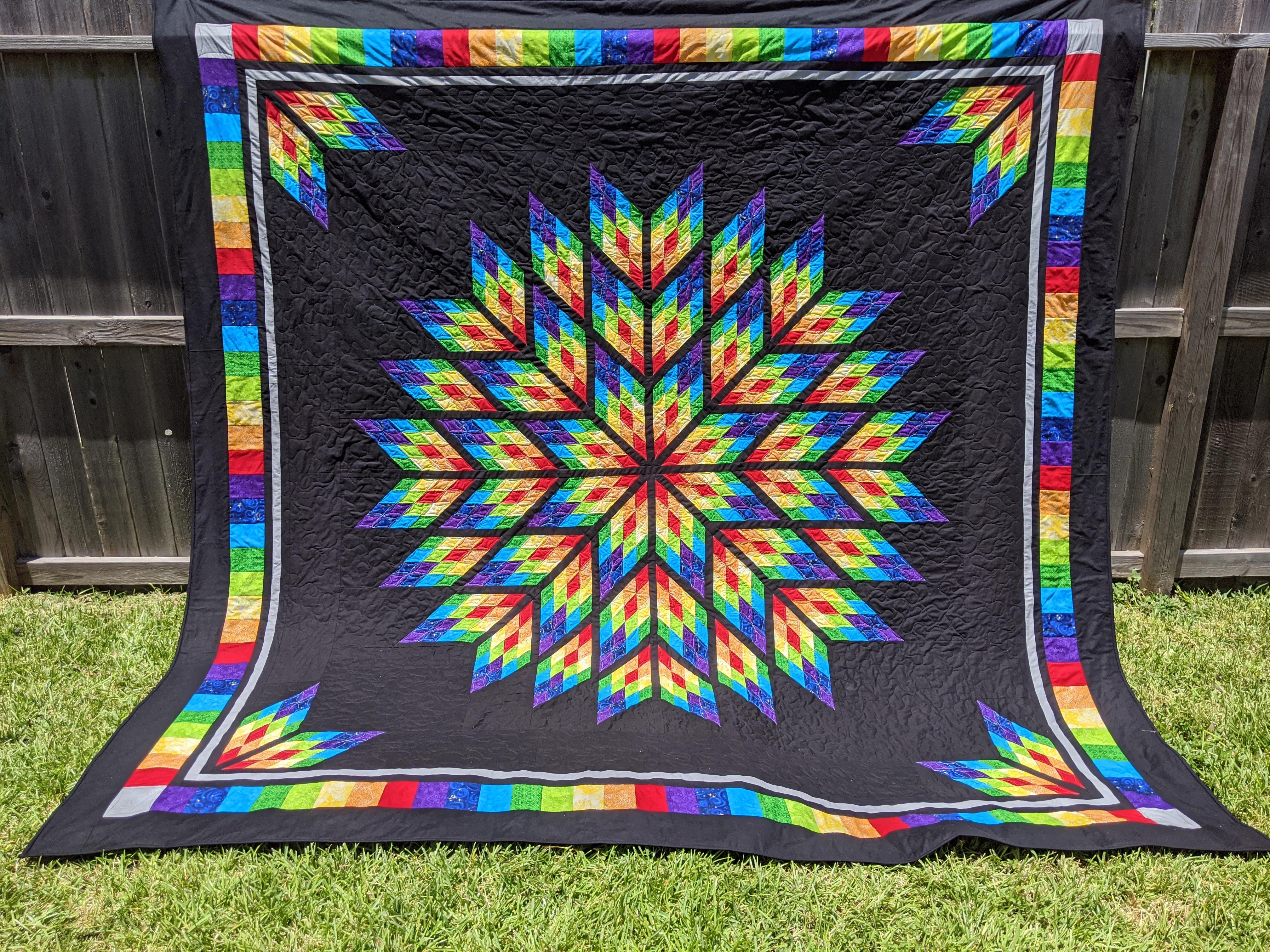 It took four months, but I finally made a rainbow quilt for me to keep