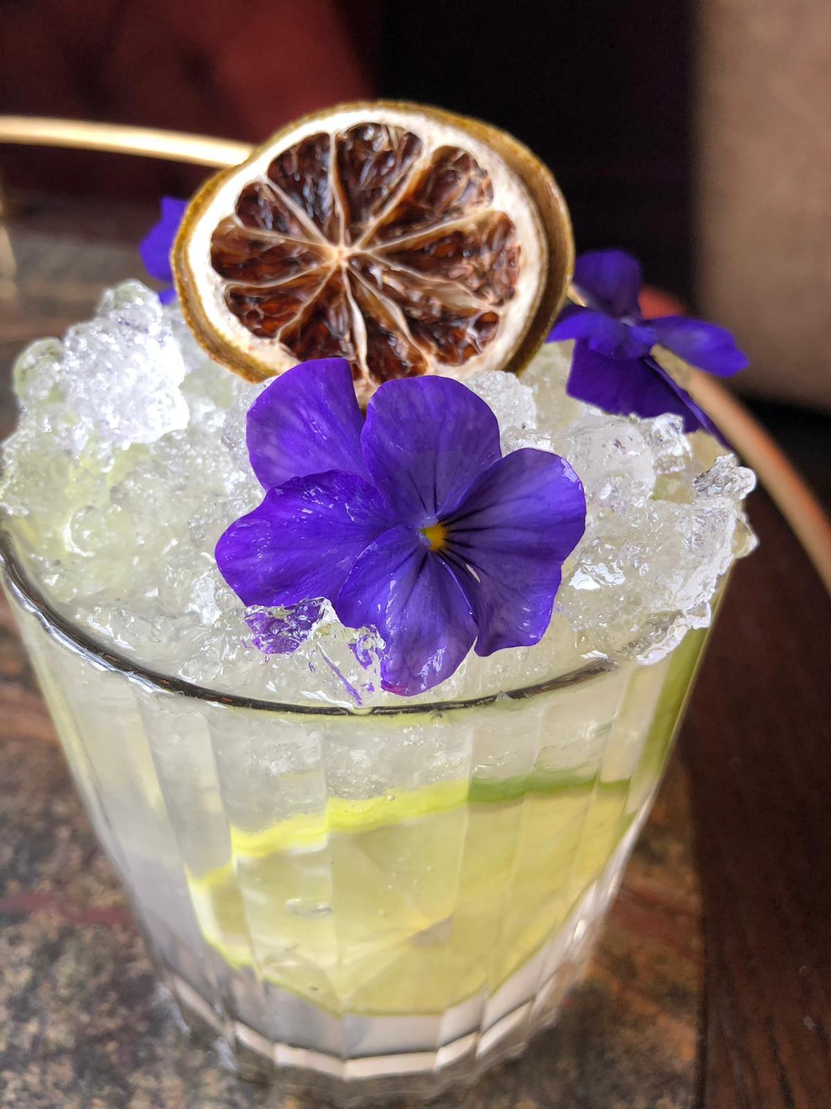 Tequila mockingbird garnished with edible flowers and dehydrated lime r/cocktails