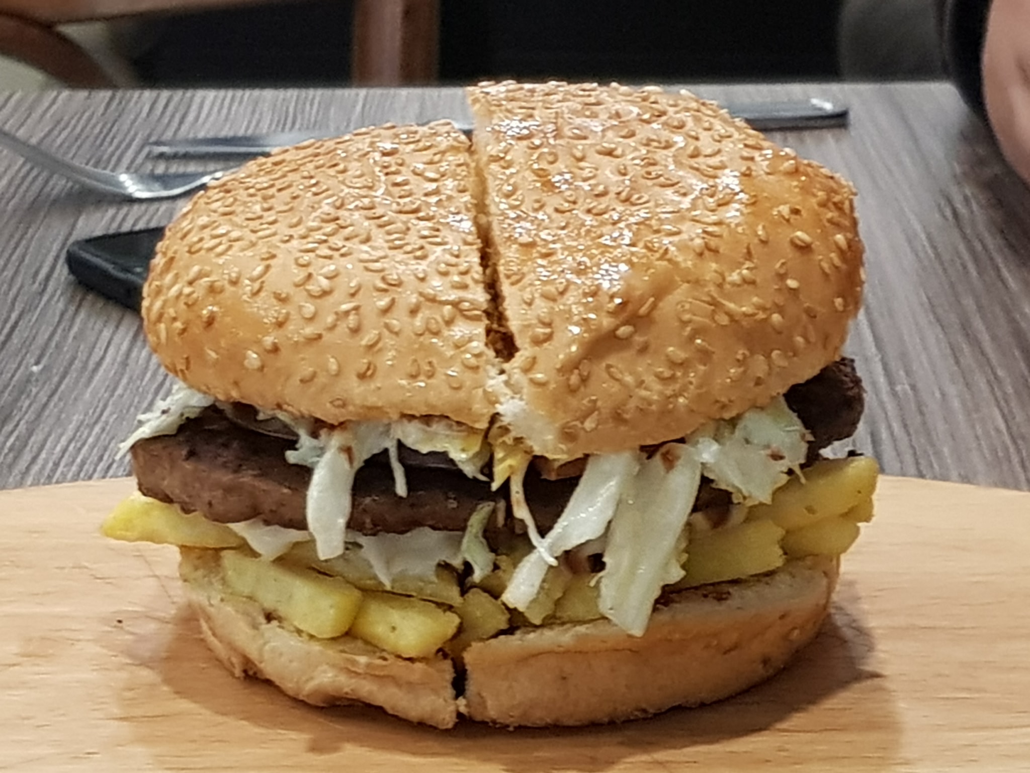 street food ''lebanese burger'' , with french fries and cole slaw in it