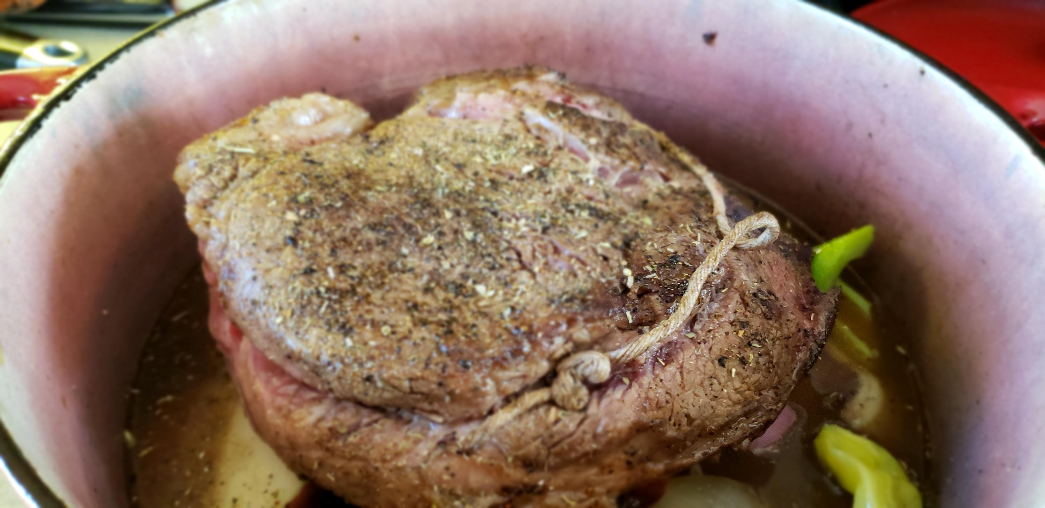 Tonight's pot roast in a wellloved enameled cast iron Dutch oven. r/castiron