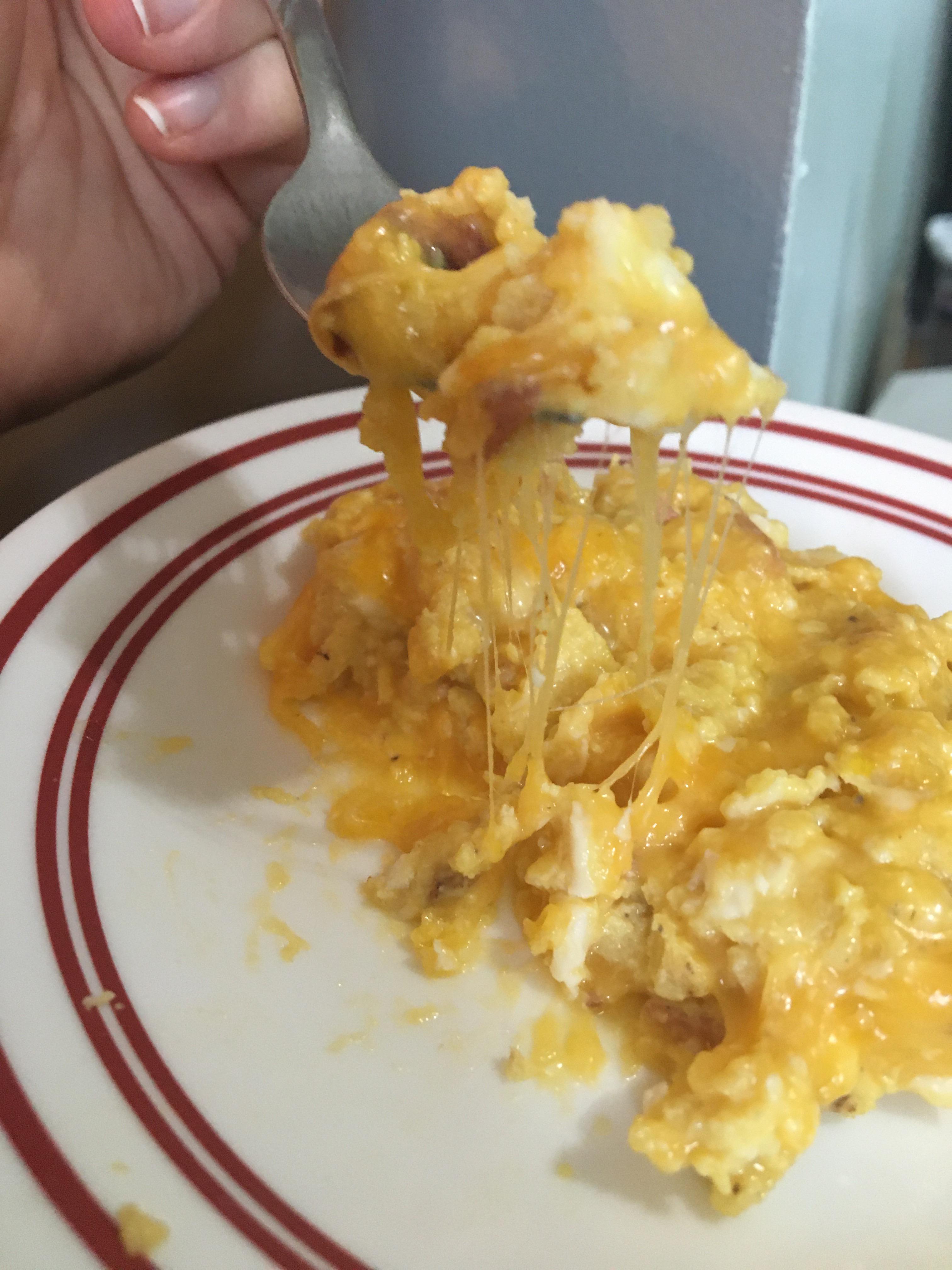 The ugliest, most delicious scrambled eggs shredded cheese with eggs