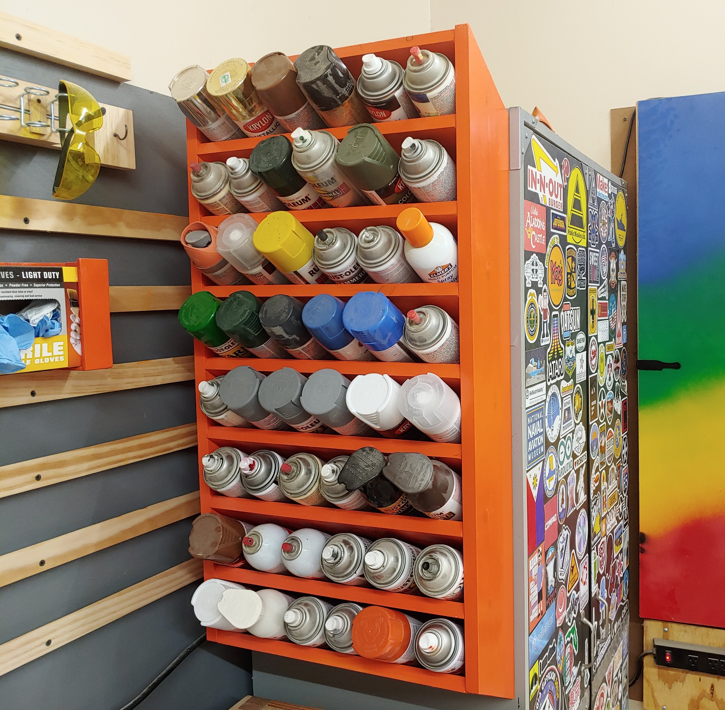 We built a spray paint rack to replace our old spray paint rack. This