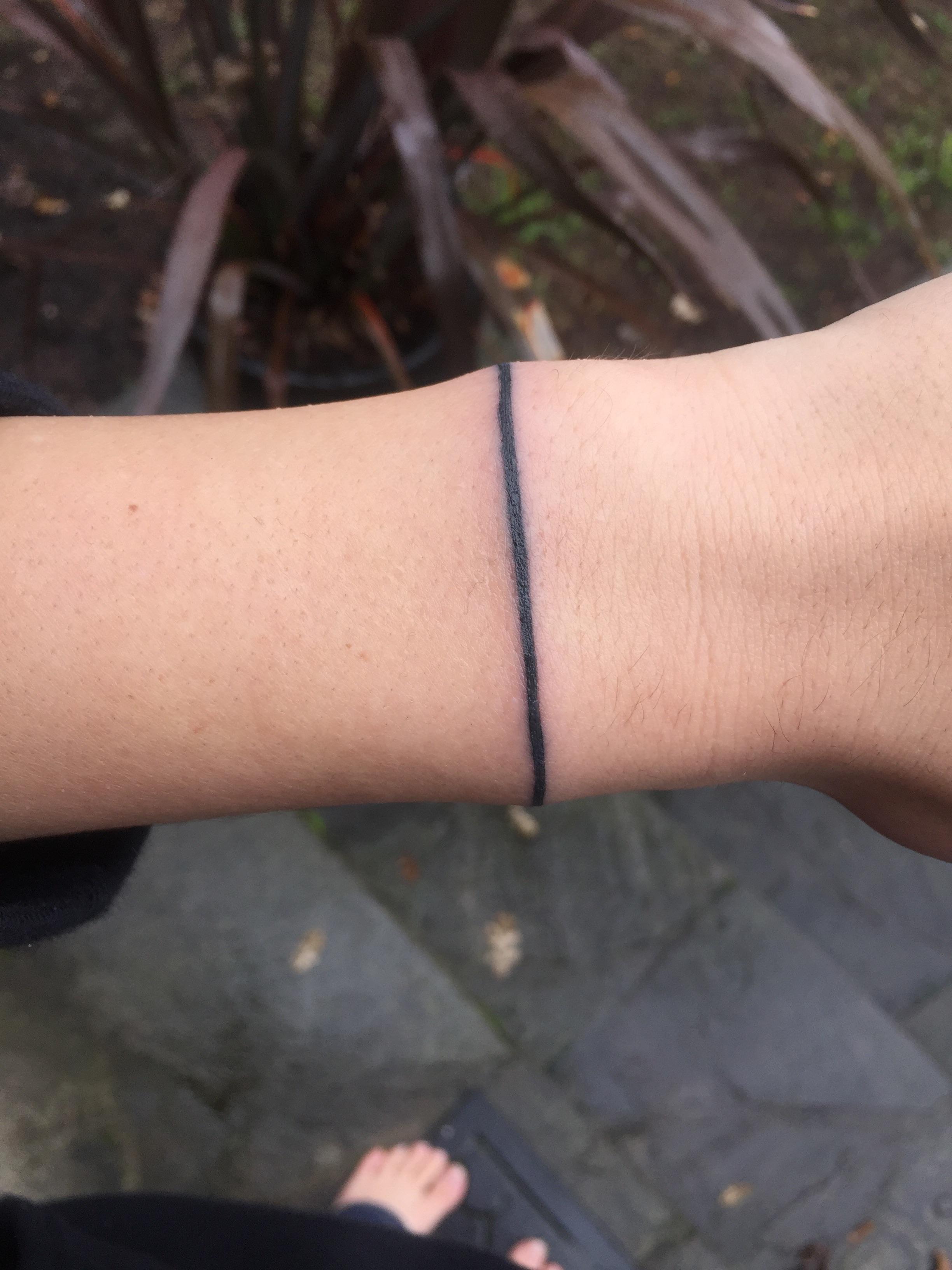 black solid armband tattoo in remembrance of my cousin post suicide
