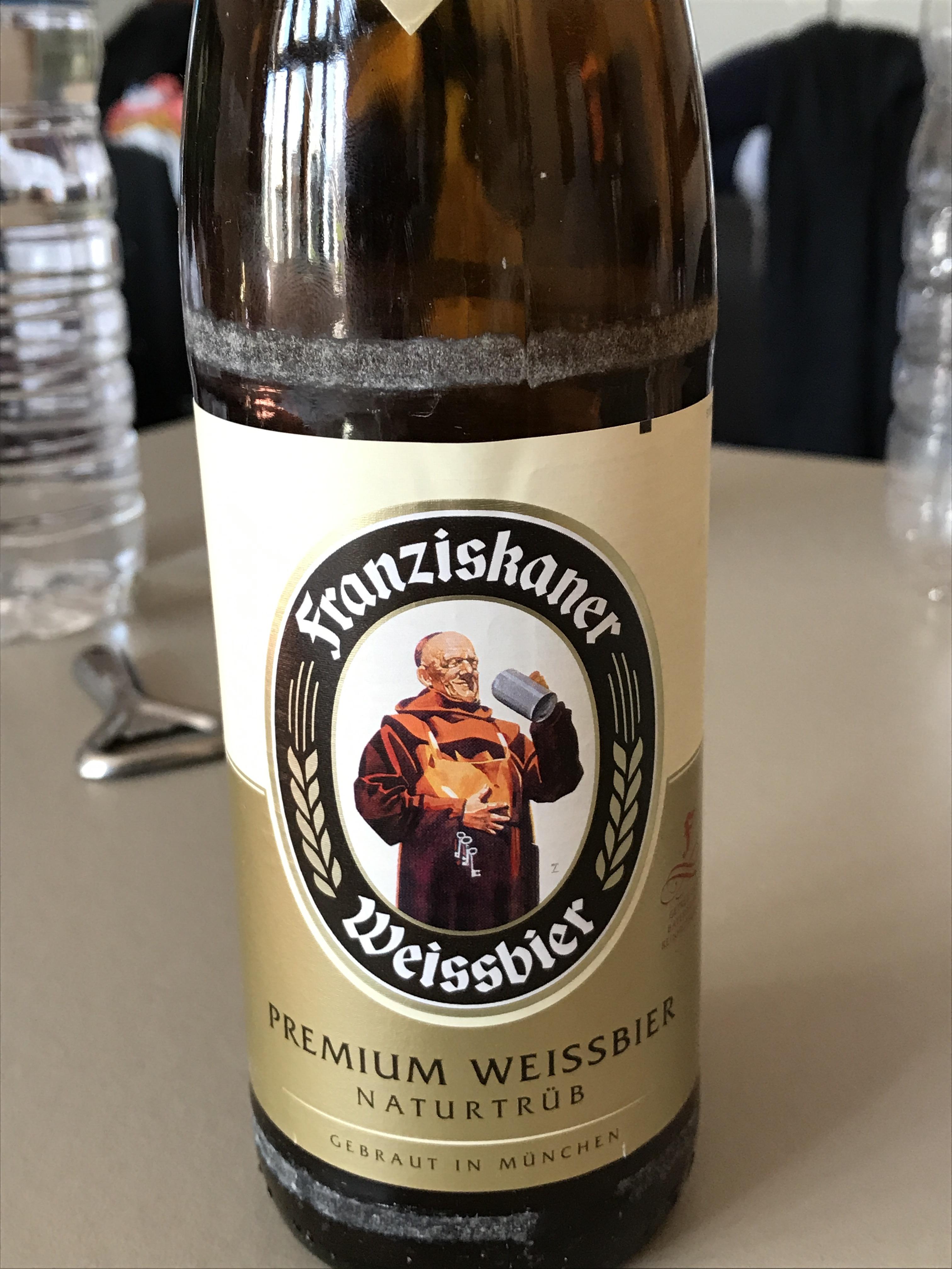 [Photograph] A monk looking at beer on a beer bottle r/monkslookingatbeer