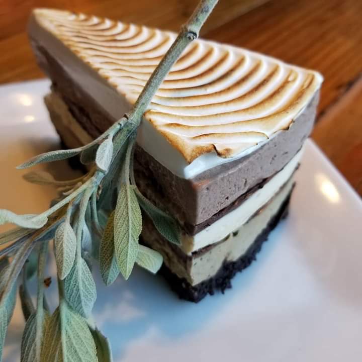 [OC] Mudslide Ice Cream Cake with Meringue Topping and Sage Garnish