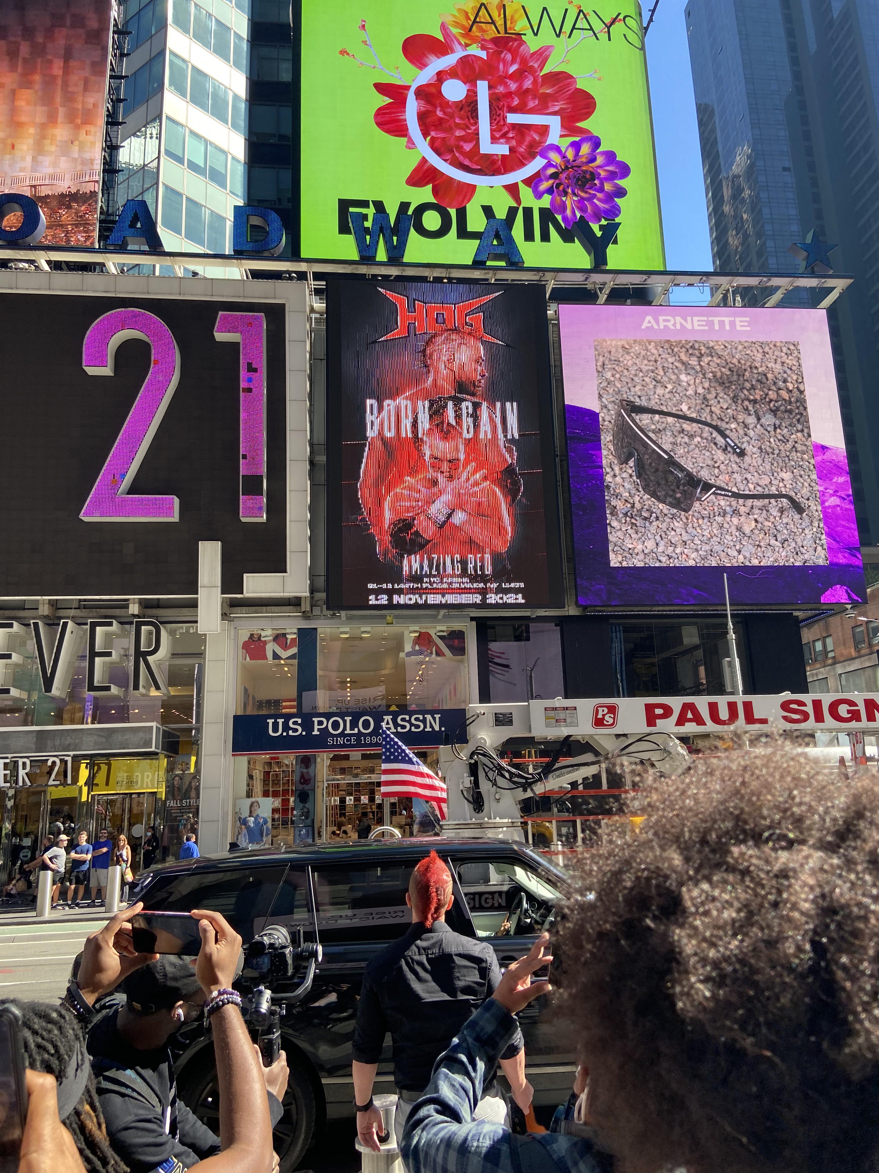 House Of Glory billboard in Times Square with Amazing Red looking on