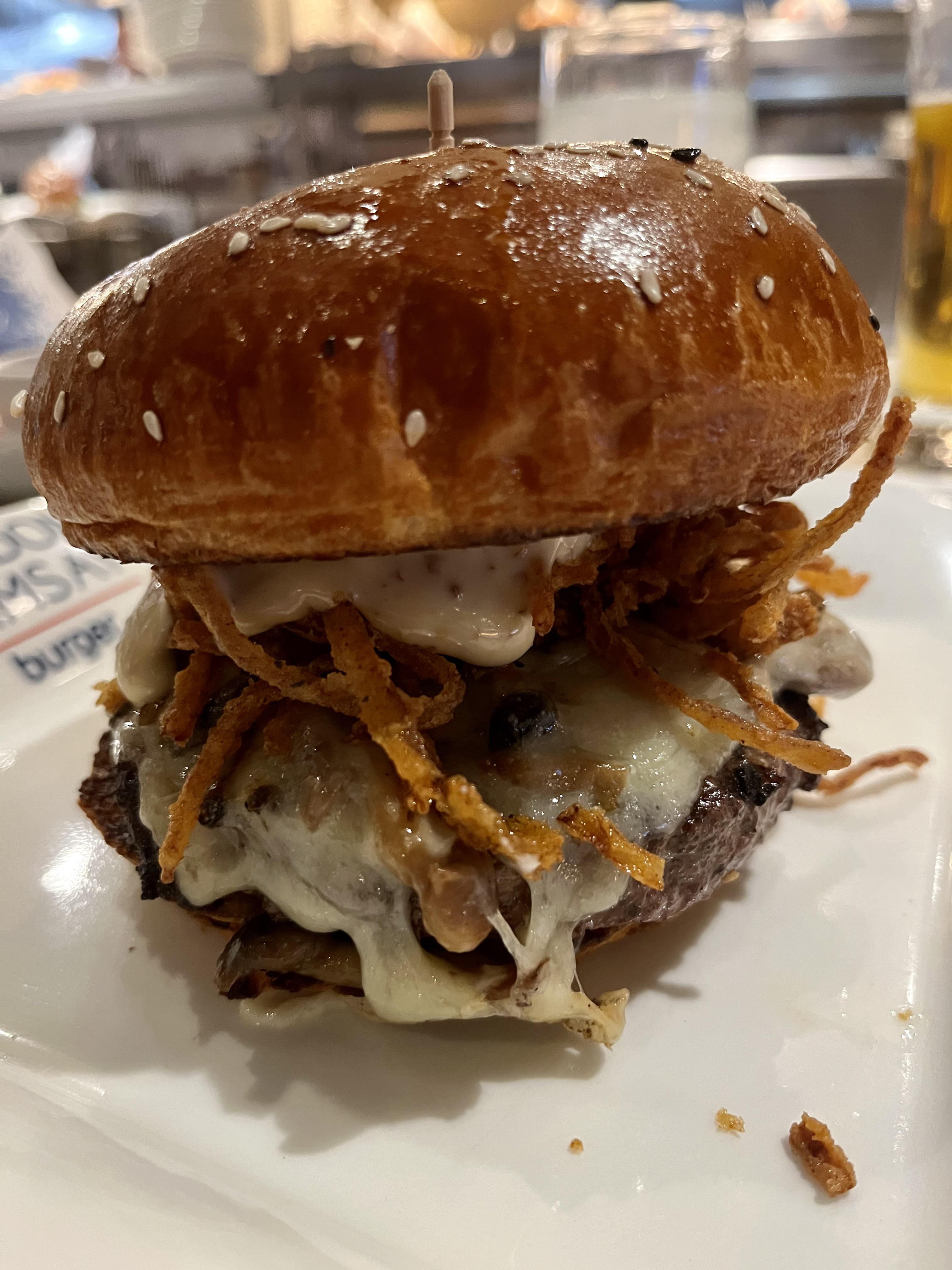 [I ate] burger with mushrooms, gruyere cheese, crispy string onions and