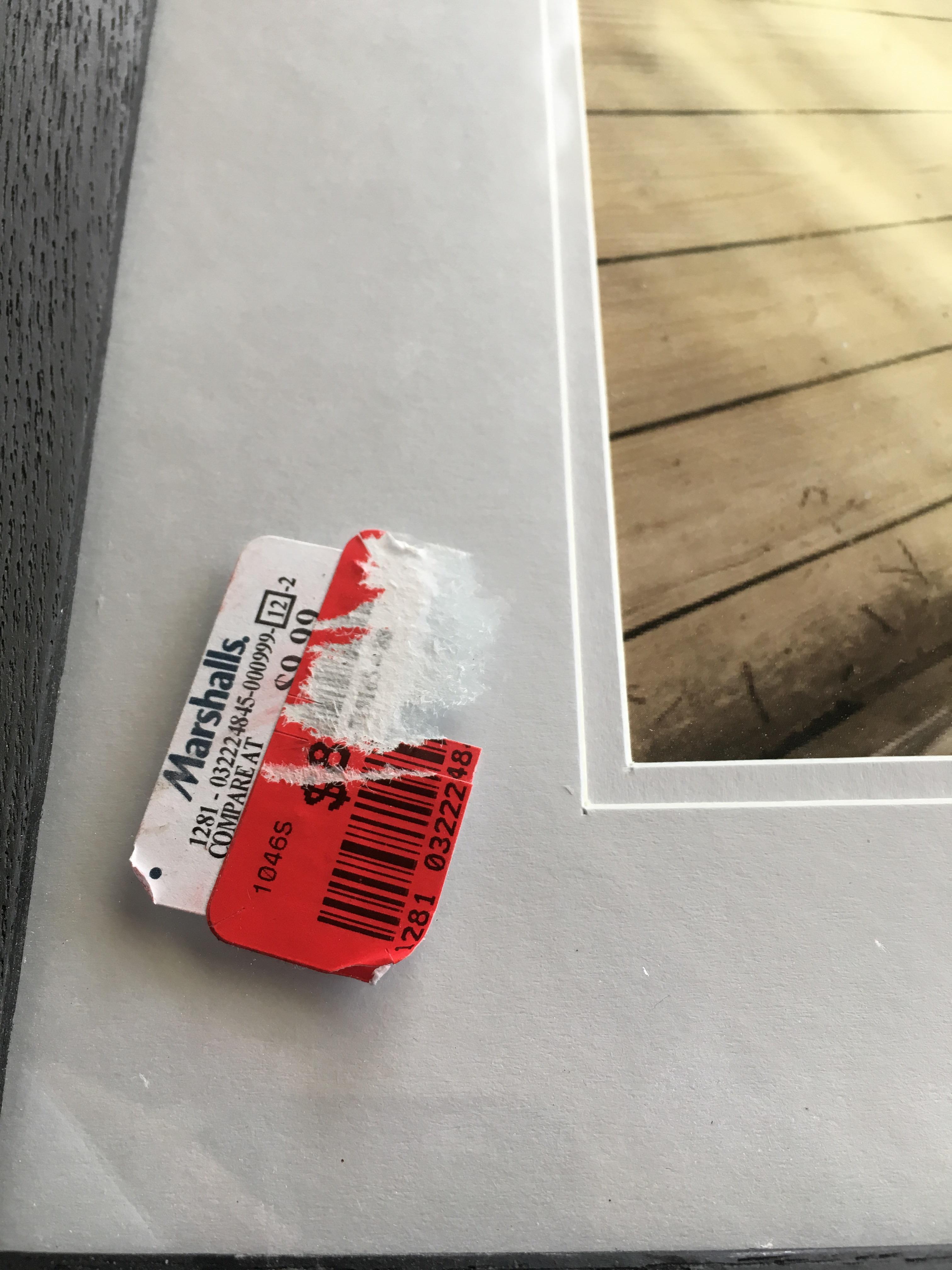 Stickers on the glass of a picture frame. r/mildlyinfuriating