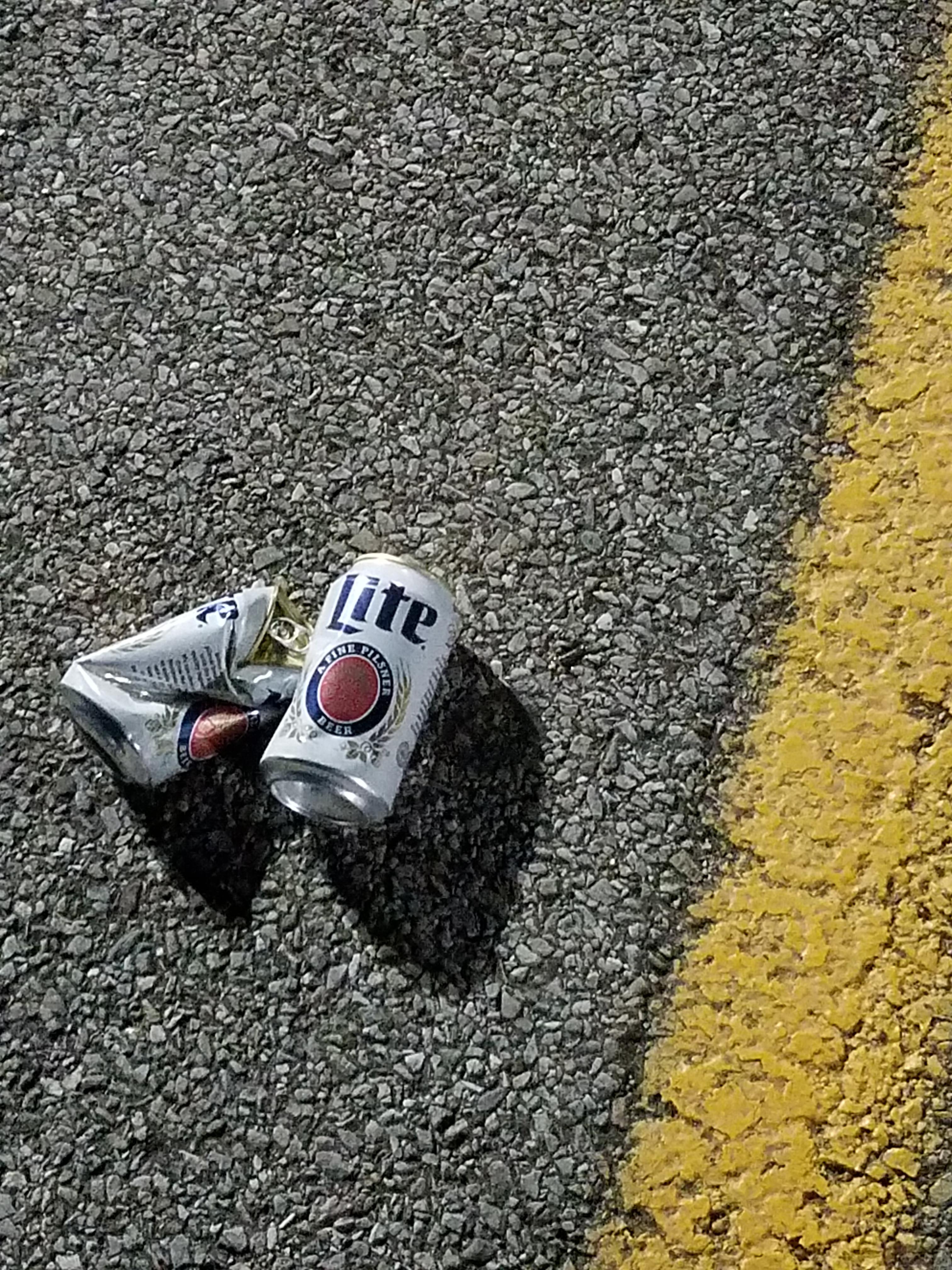 Nothing quite screams "classy" like empty beer cans in the parking lot