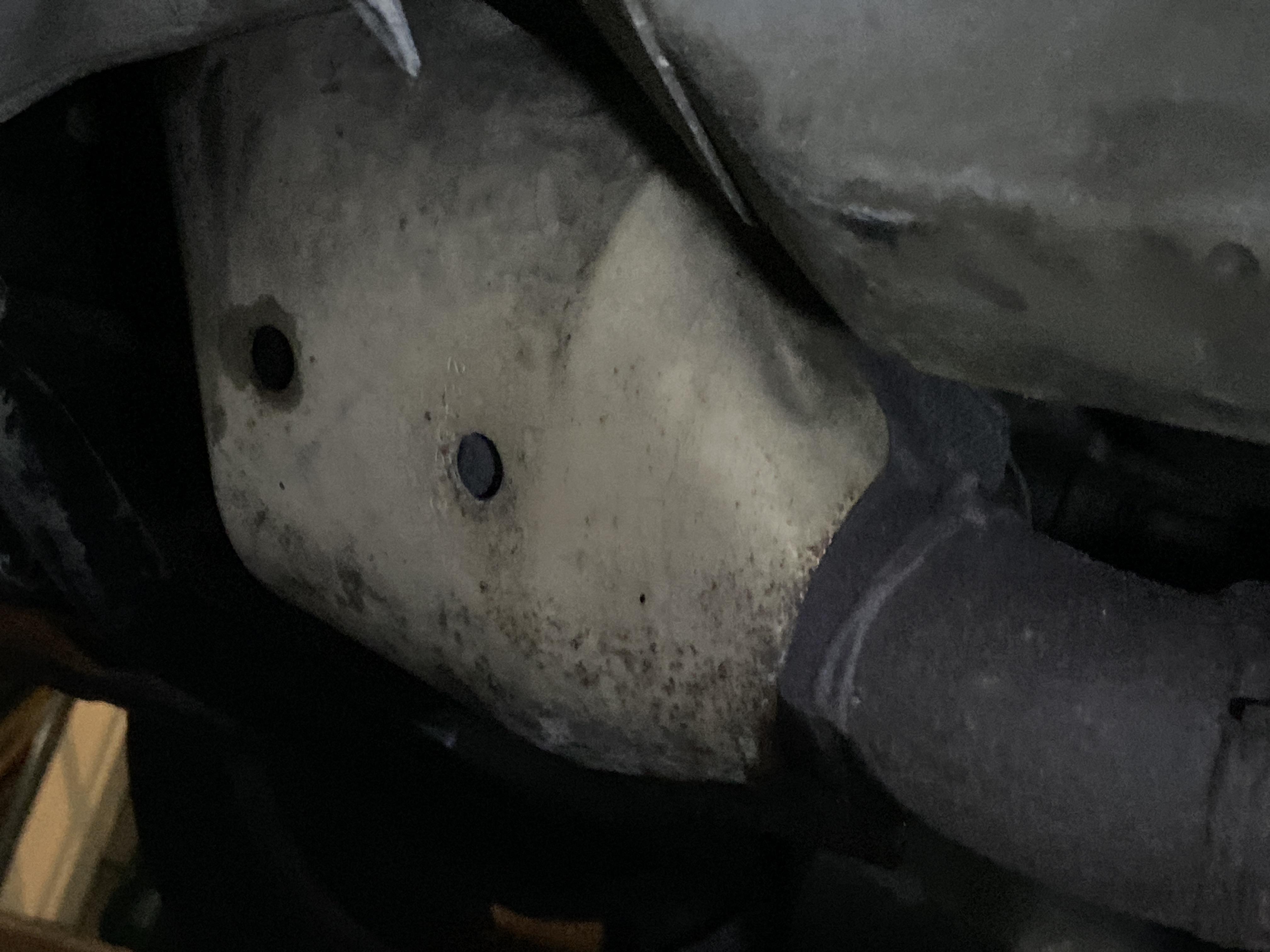 Oil leaked onto catalytic converter and down pipe from unseated valve