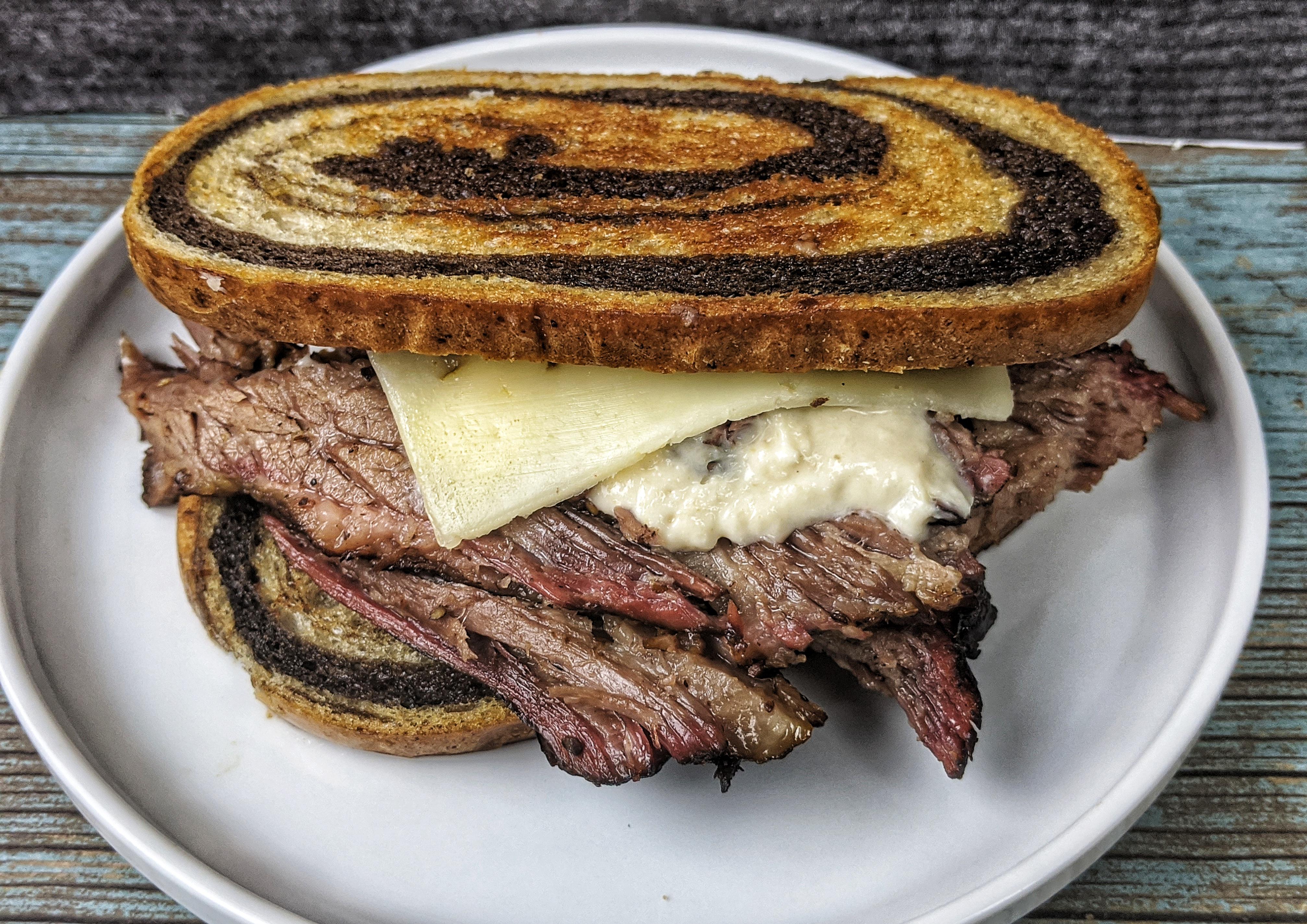Smoked brisket sandwich with pepper jack cheese and some horseradish