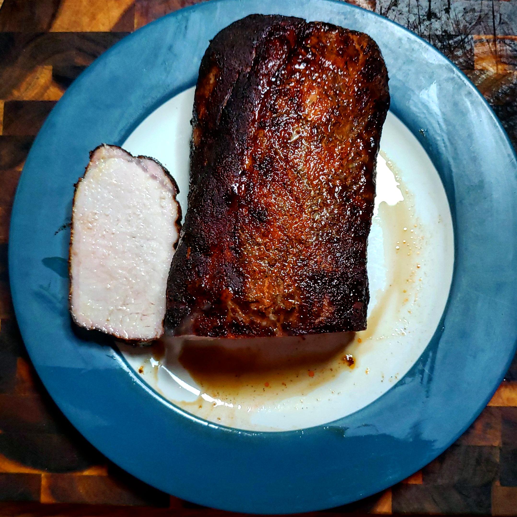 Smoked and charcoal grilled pork loin grilling