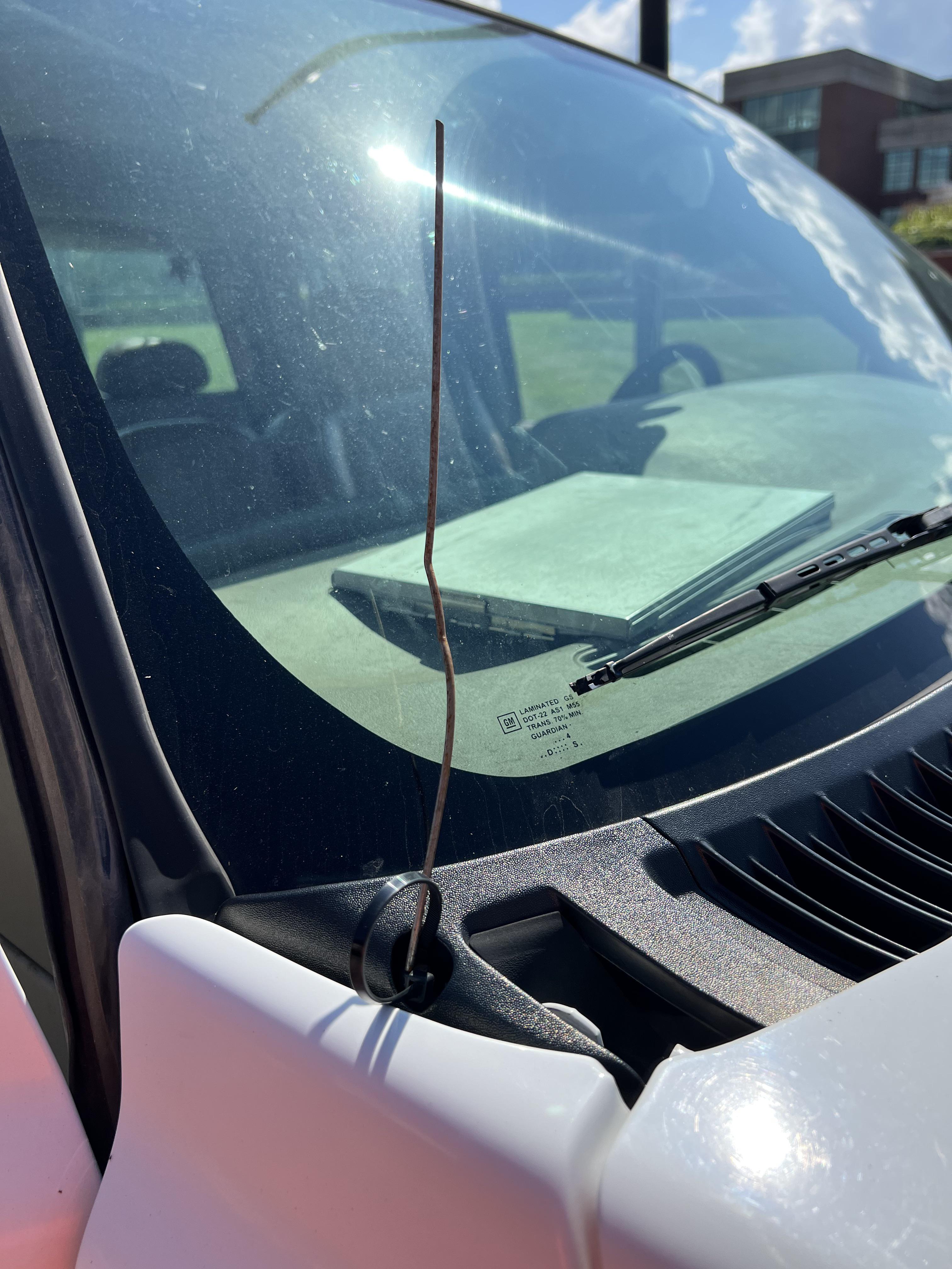 Radio antenna broke off, nothing a sod staple and a zip tie can't fix