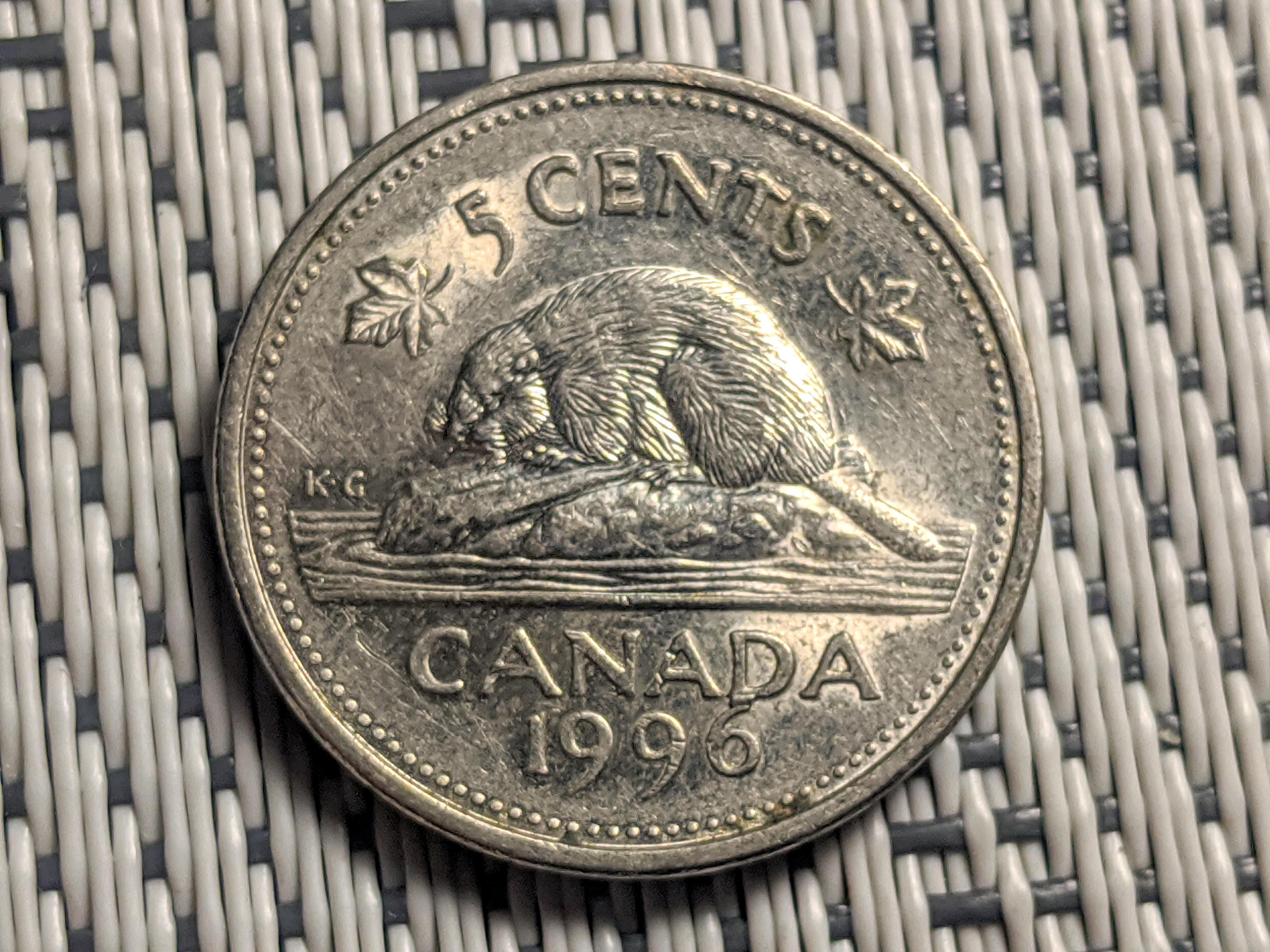 I found this 1996 nickel and the 6 is touching. Closest I've seen is