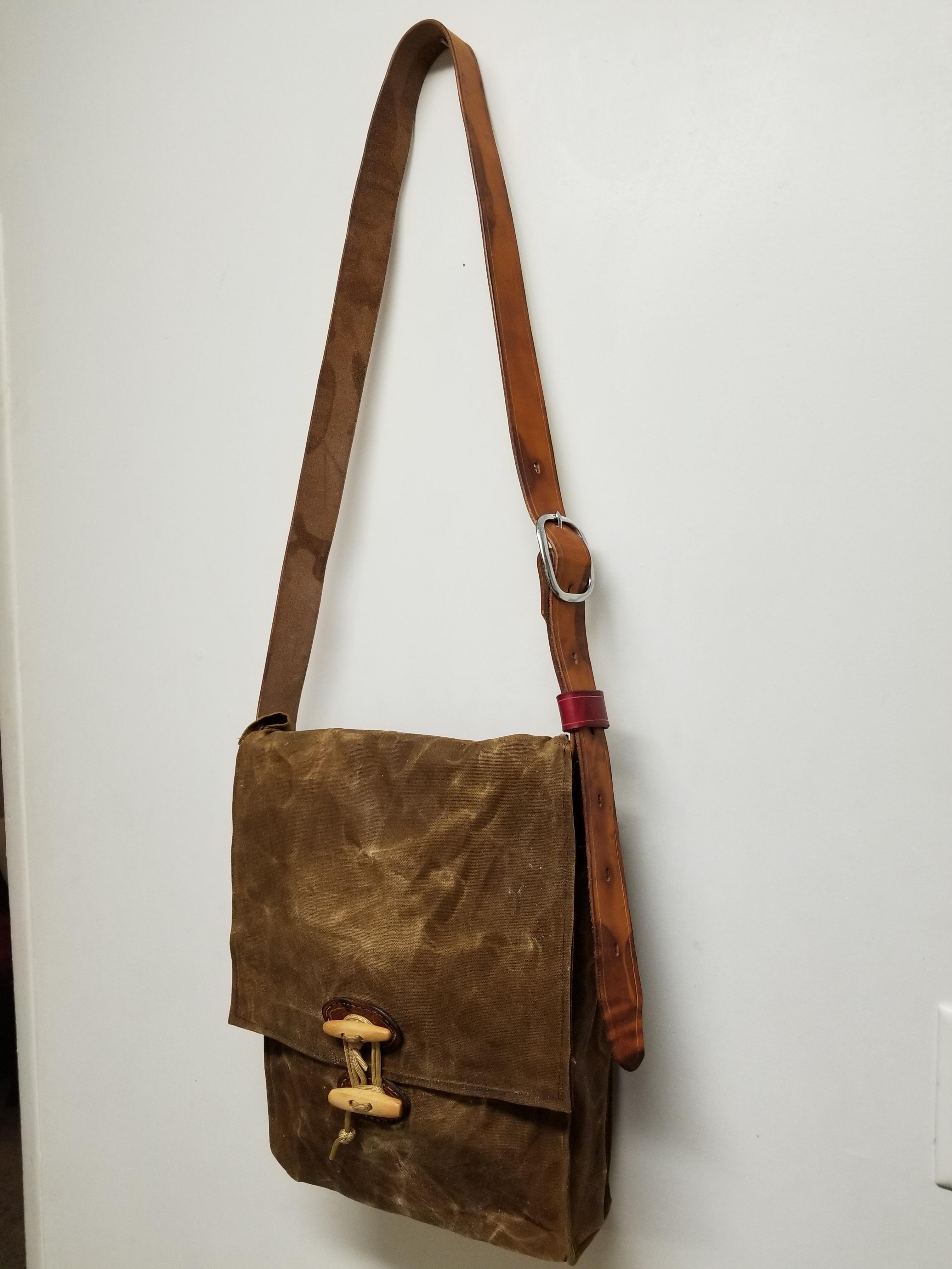 I made messenger bag/haversack with waxed canvas, leather, and carved