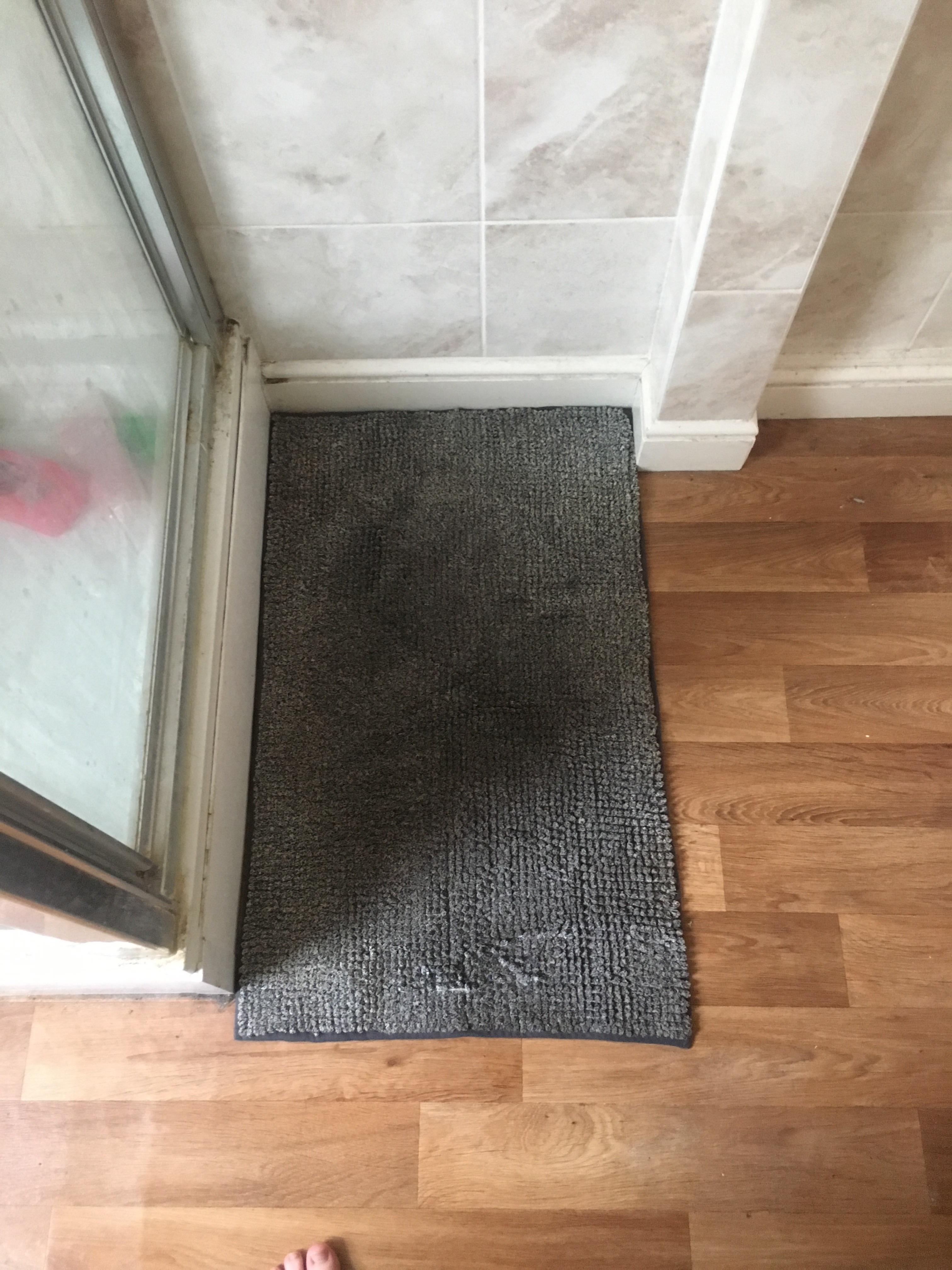 Our shower mat fits perfectly into the corner where the wall randomly