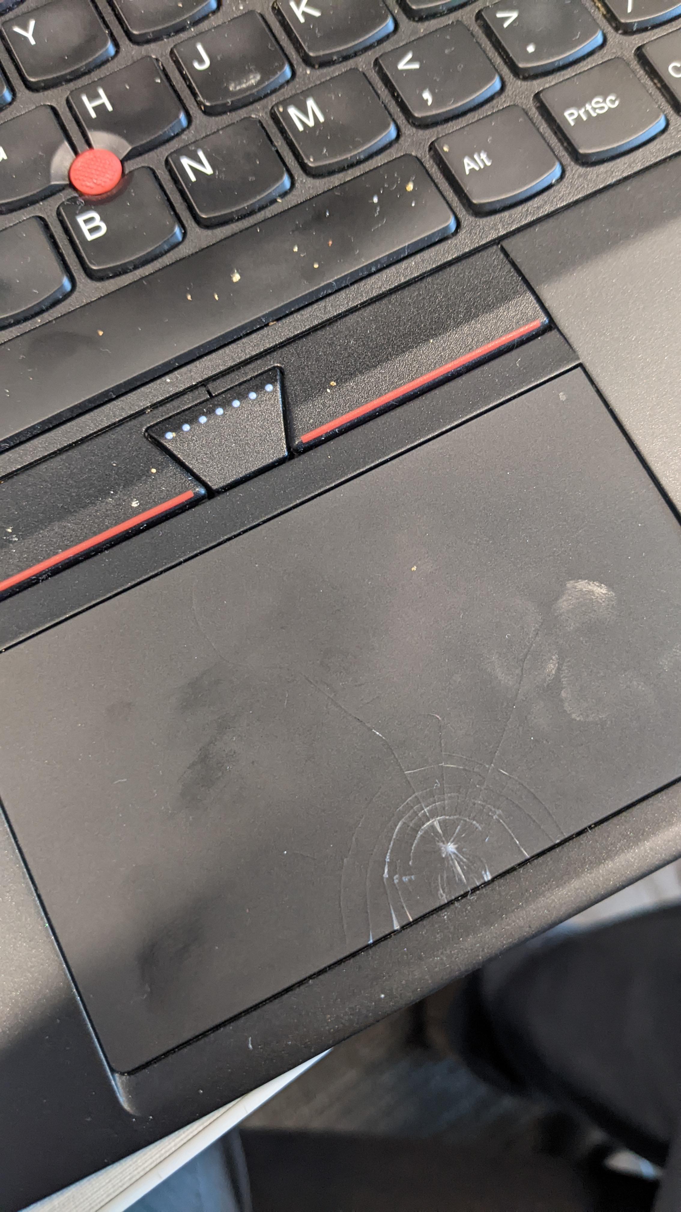 Ignoring the filthy keyboard, this ThinkPad’s trackpad was cracked by