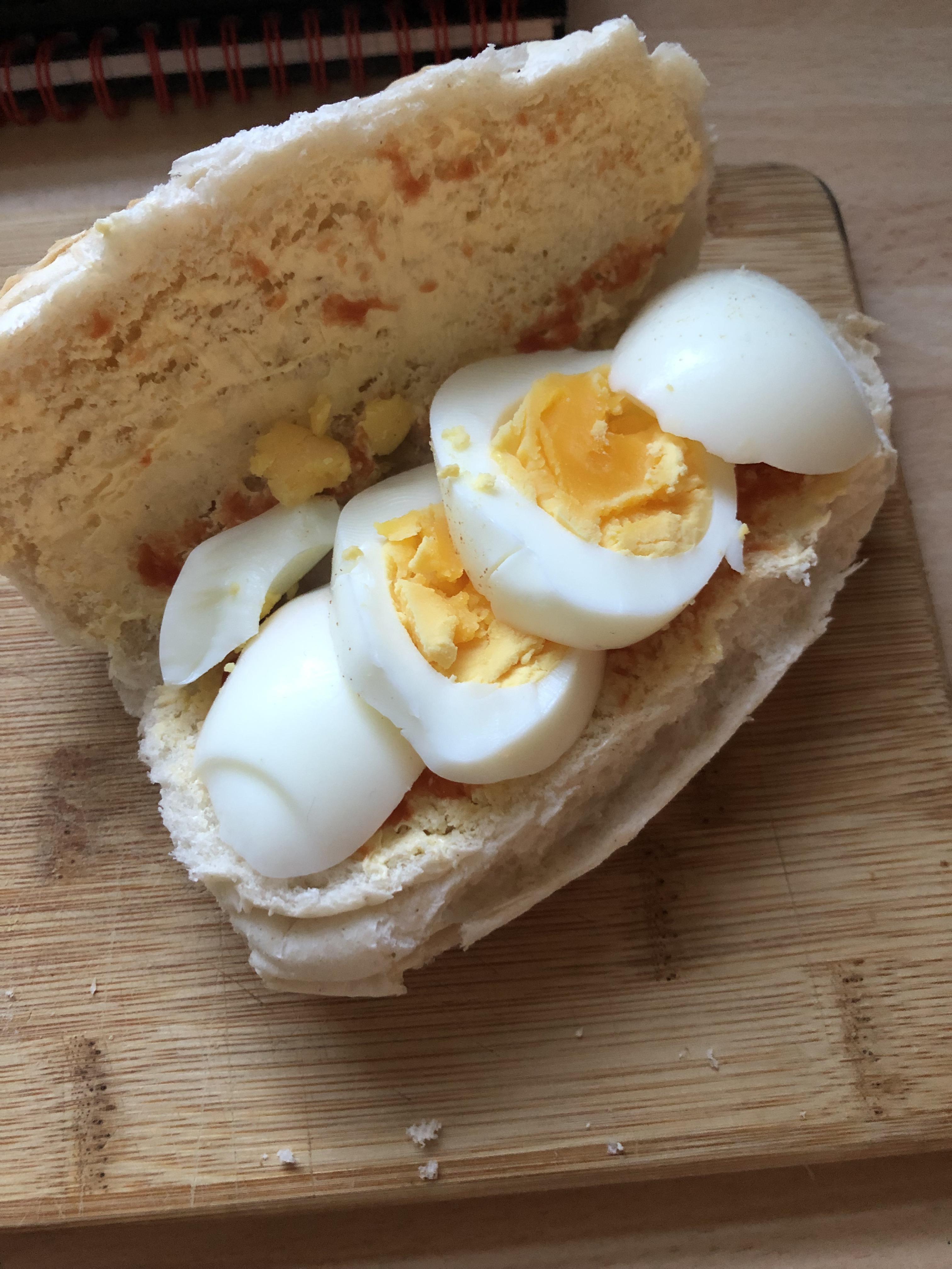 [I ate] boiled egg in a hot dog roll with red sauce r/food