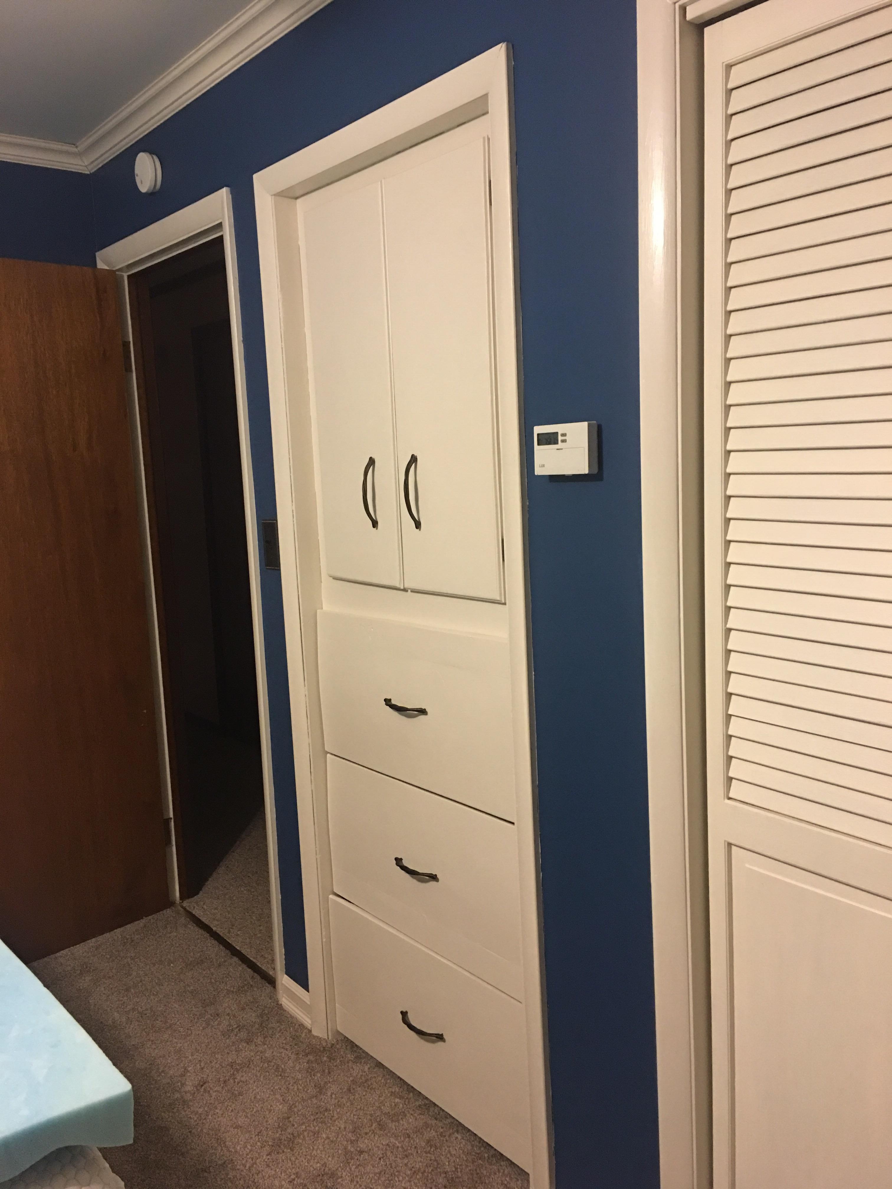 Turned an old unfinished closet into a built in dresser! Complete with