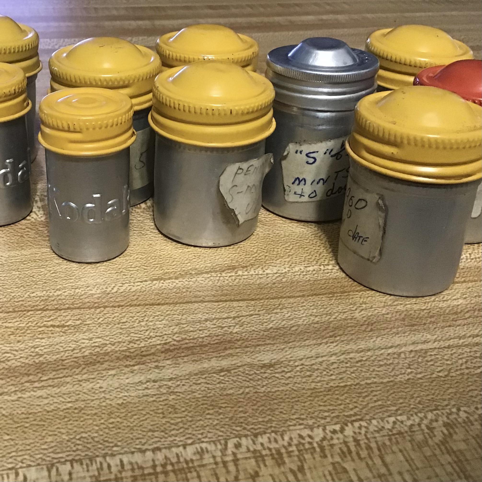 Old metal film canisters. Two small ones say Kodak. Don’t know anything