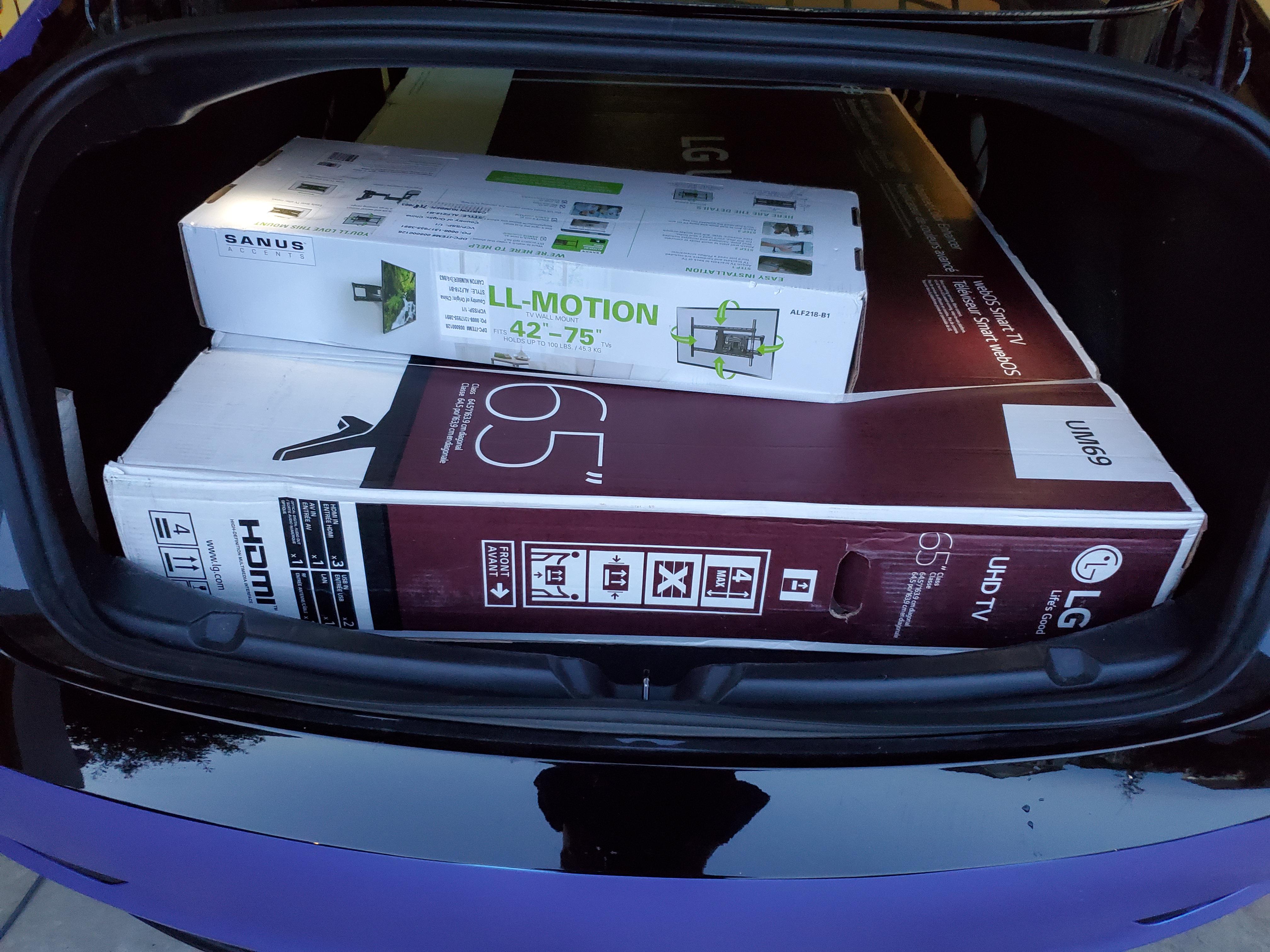 65 inch TV box fits if you're willing to force it in r/TeslaModel3