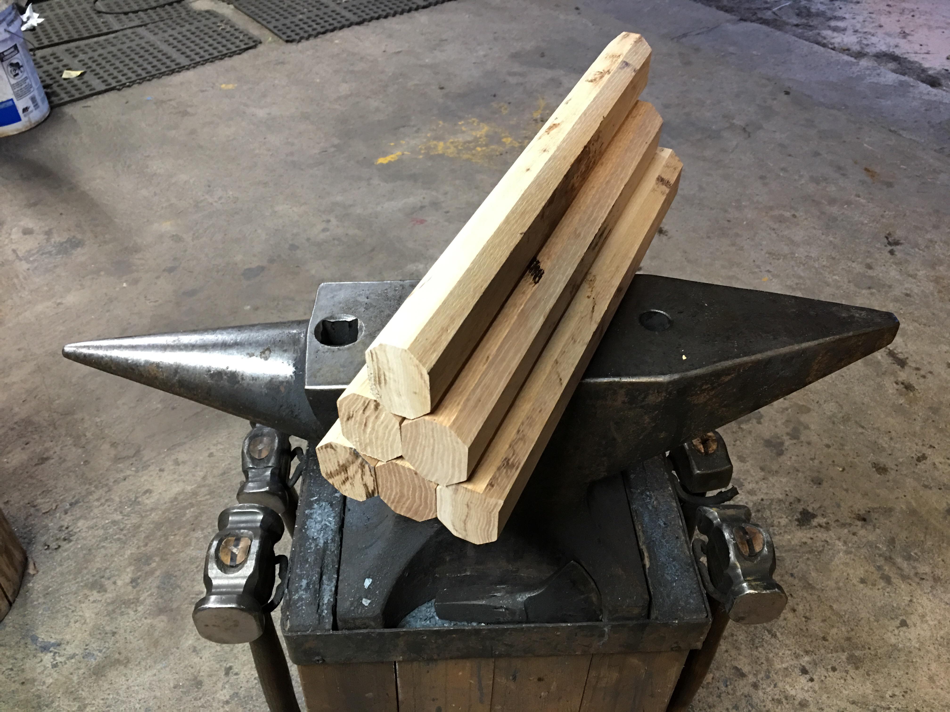 Some hammer handle blanks cut from a hickory board. Note the grain