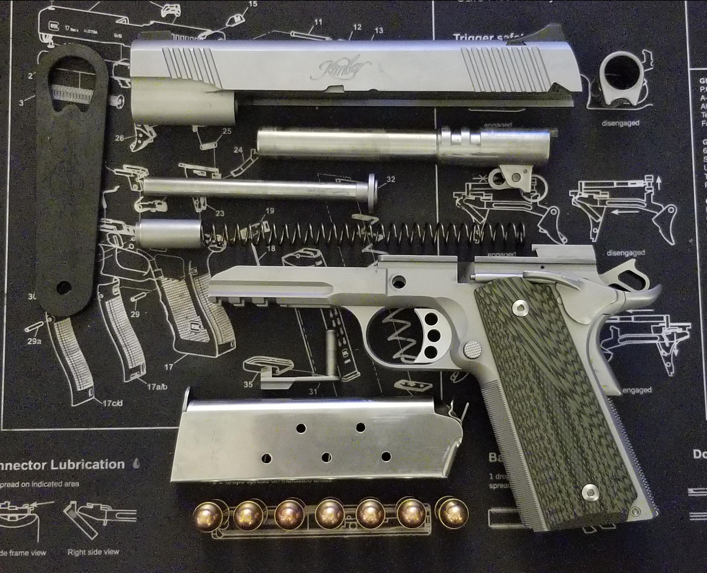 The inaugural cleaning of my first 1911. I'm in love! r/GunPorn