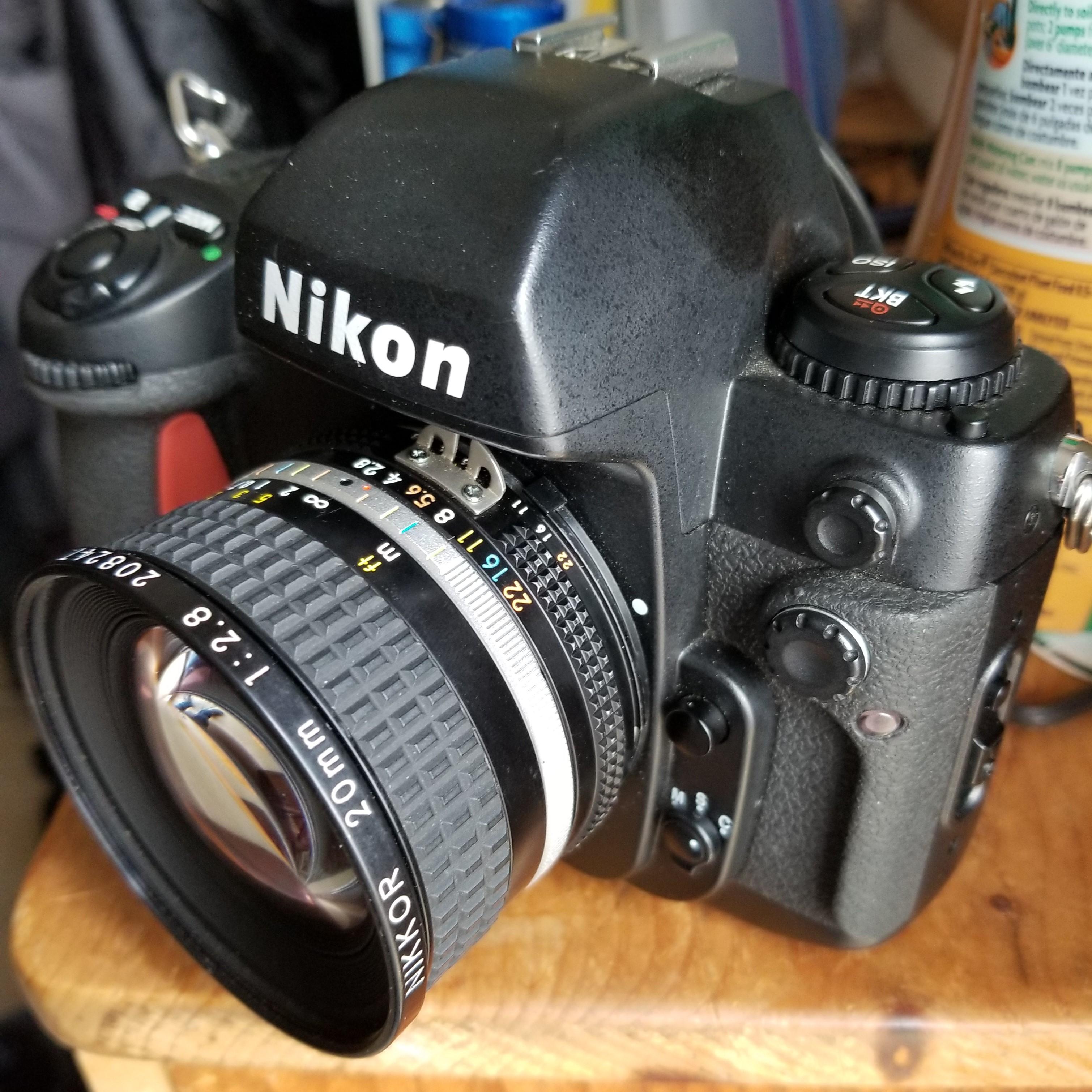 Bought a Nikon F100. Came with a different lens than listed. How'd I