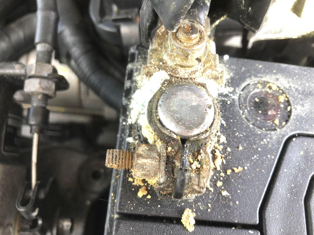 What exactly is the white corrosive powder on my positive terminal and