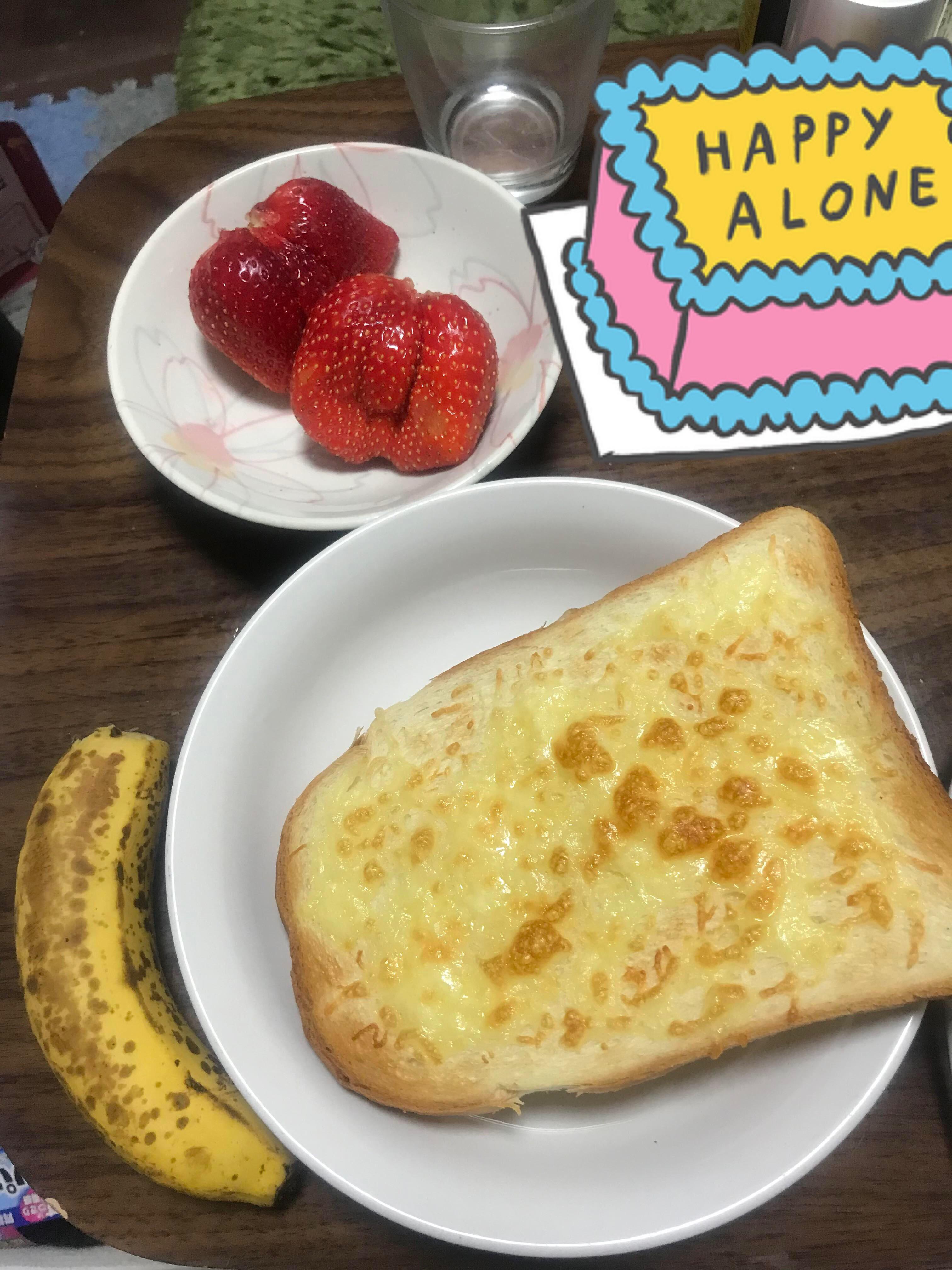 White bread toast with cheese, 2 big strawberries and 1 banana my