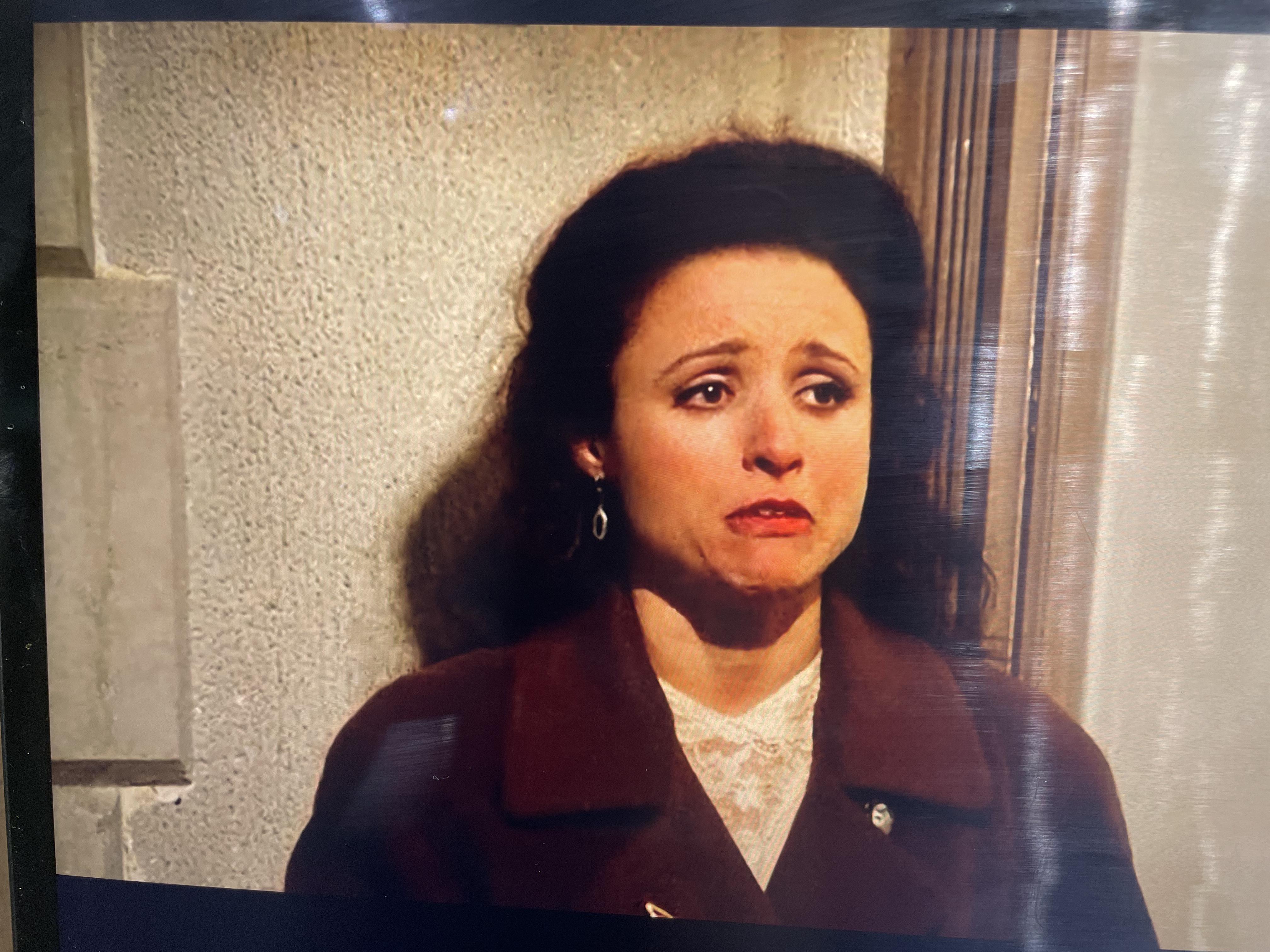 Elaine crying while arguing with Tim Whatley about the label maker, is