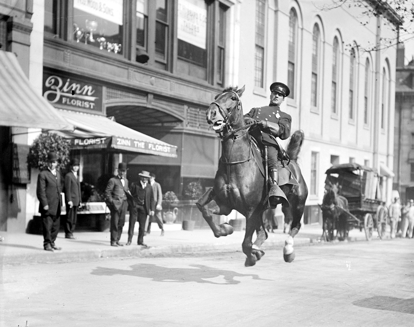 Mounted cop flies down Tremont Street, Boston 1920s Photo by Leslie