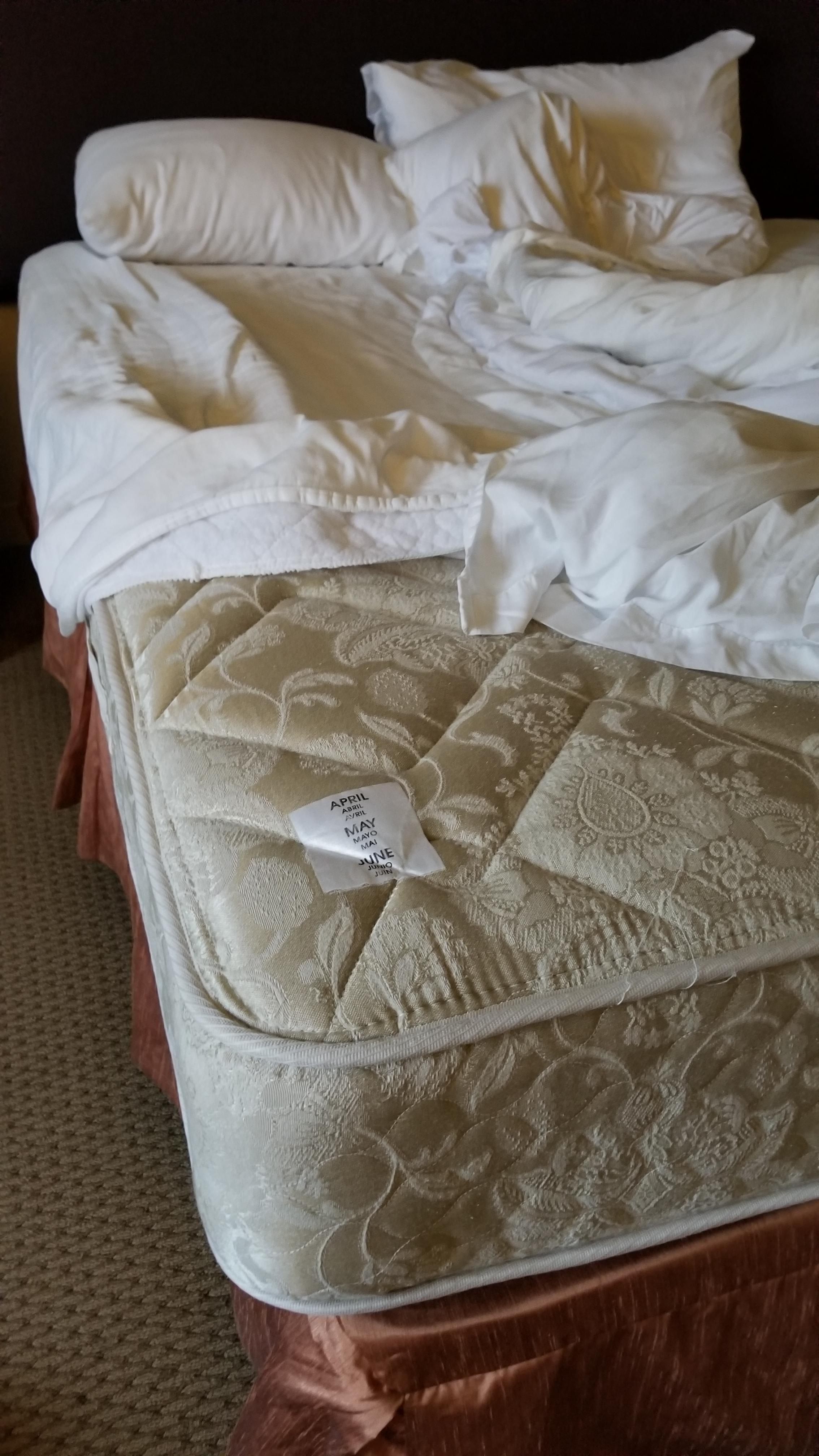 My hotel bed has tags on the corners so staff flip the mattresses