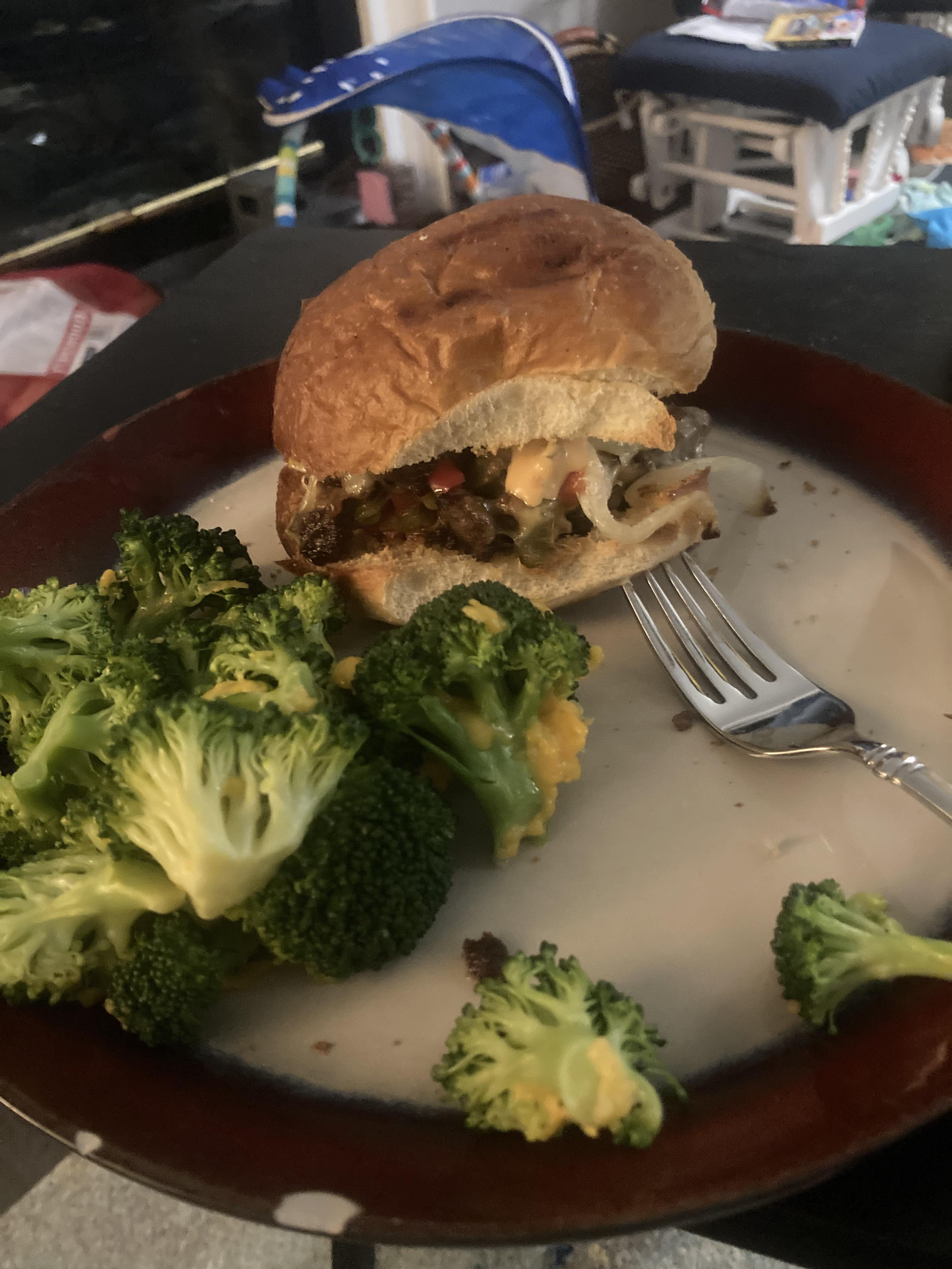 Chopped burger with sautéed peppers and onions topped with 1000island