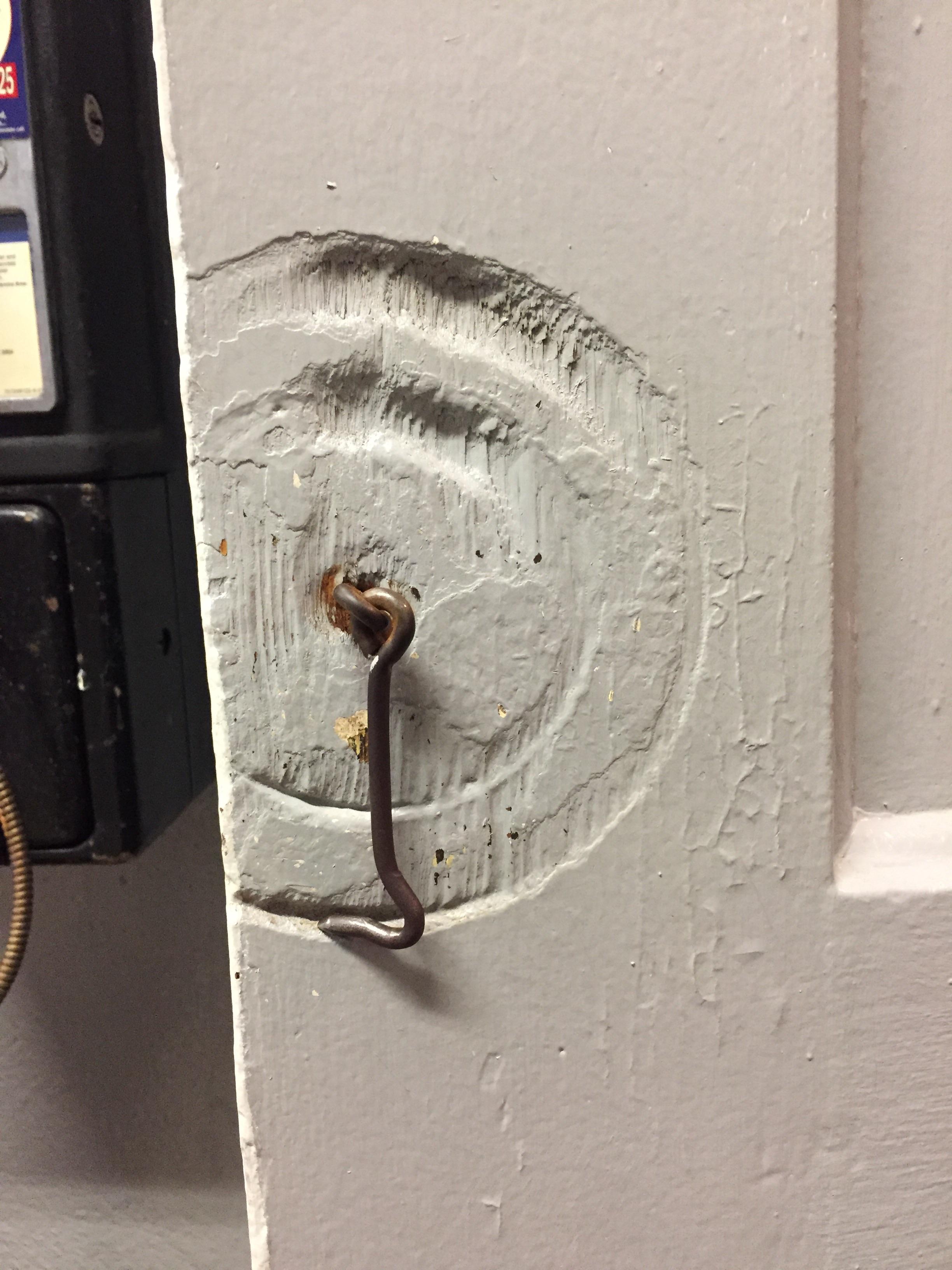 The way this bathroom lock has worn the door over the years