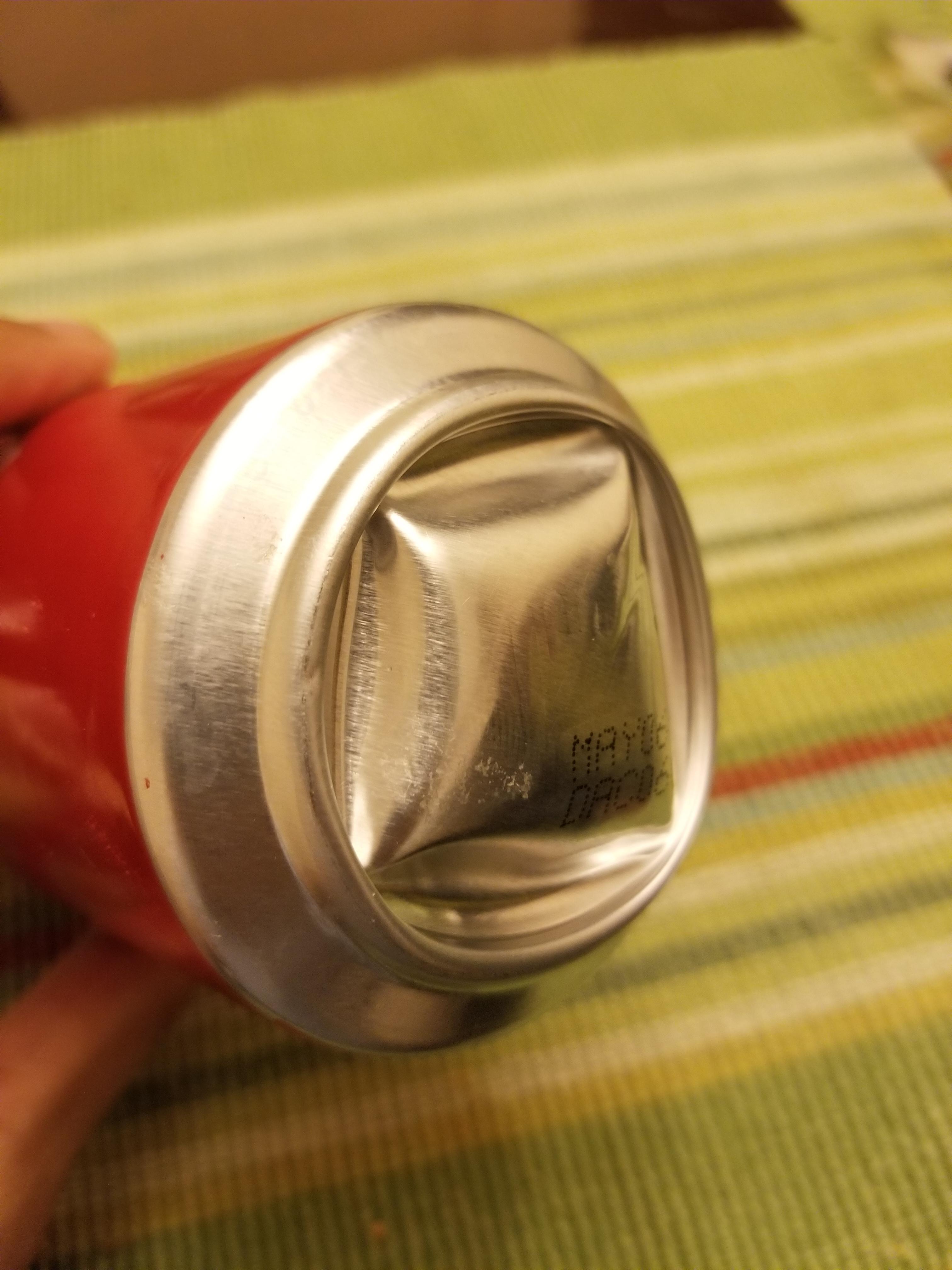 This coca cola can had so much pressure in it that it bulged the bottom