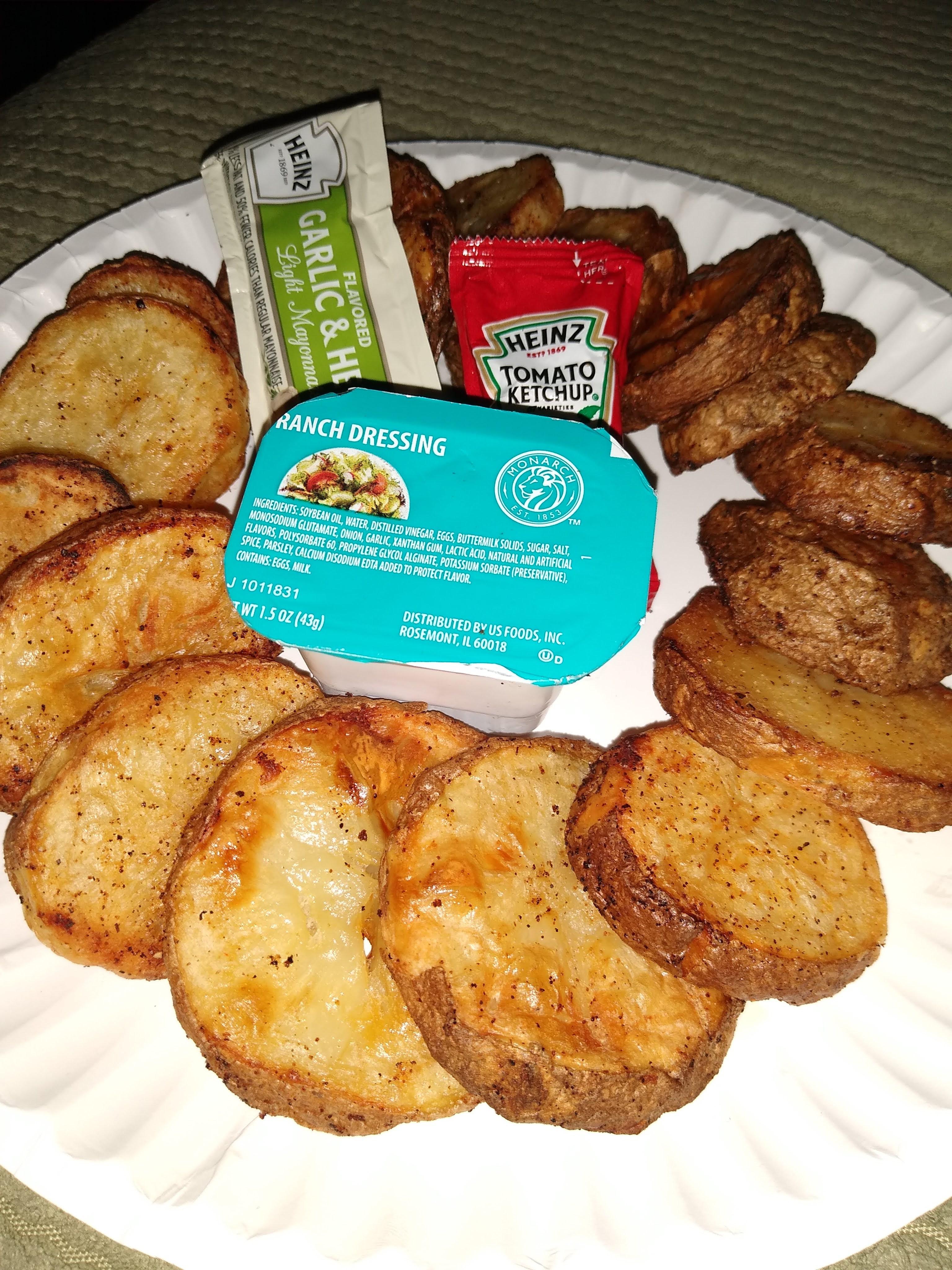 2 potatoes, a pat of butter, seasoning, and free condiments. Pennies