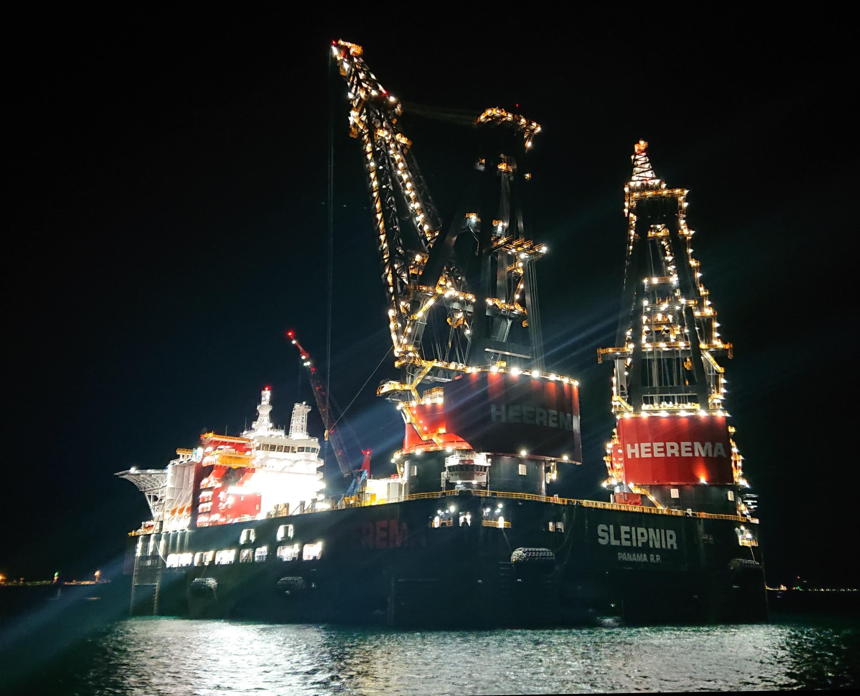 "Sleipnir", a massive heavylift crane vessel, lit up like a christmas